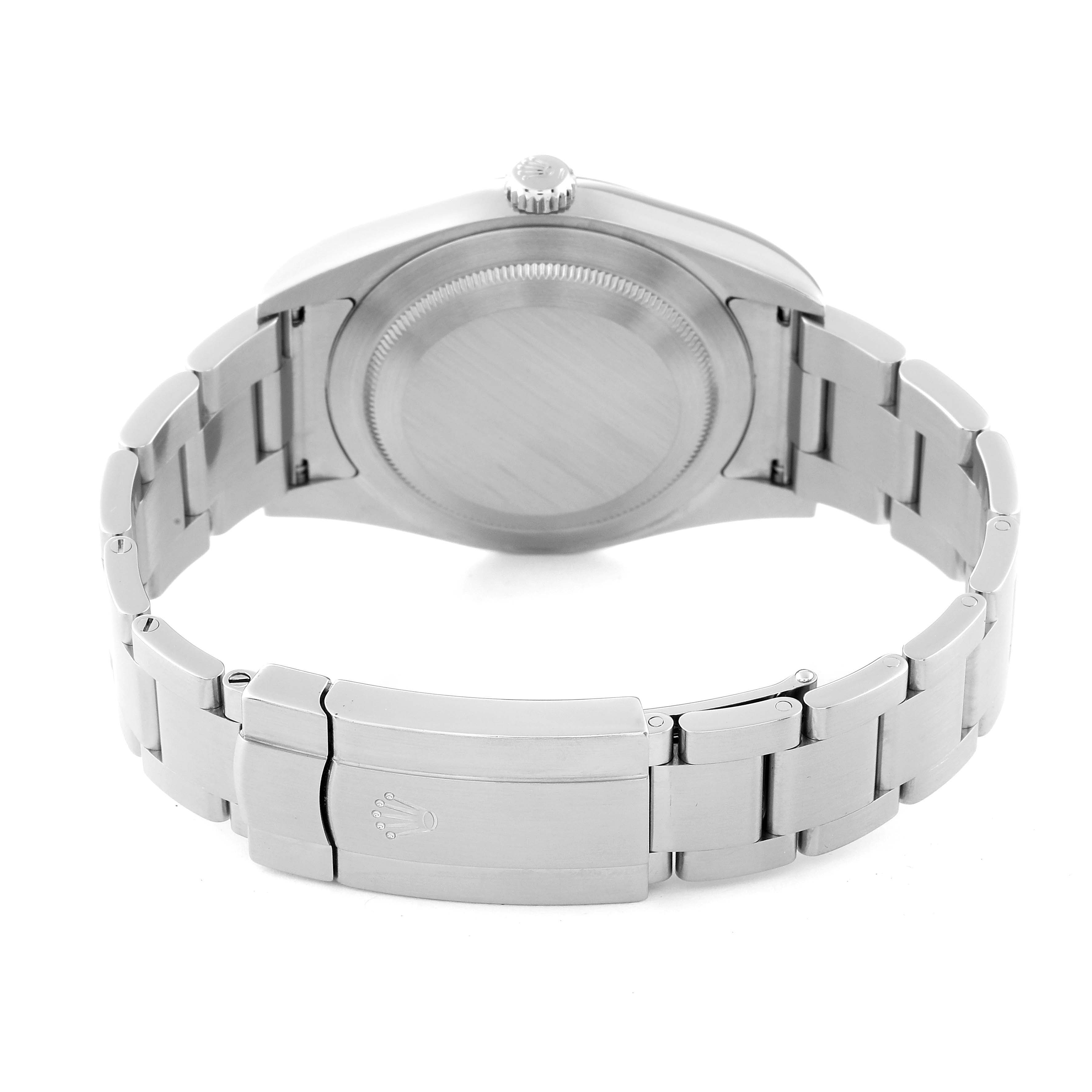 This image shows the underside and clasp of the Rolex Oyster Perpetual 114300 Men's Stainless Steel Blue Dial 114300 Men's Stainless Steel Blue Dial watch from a rear angle.