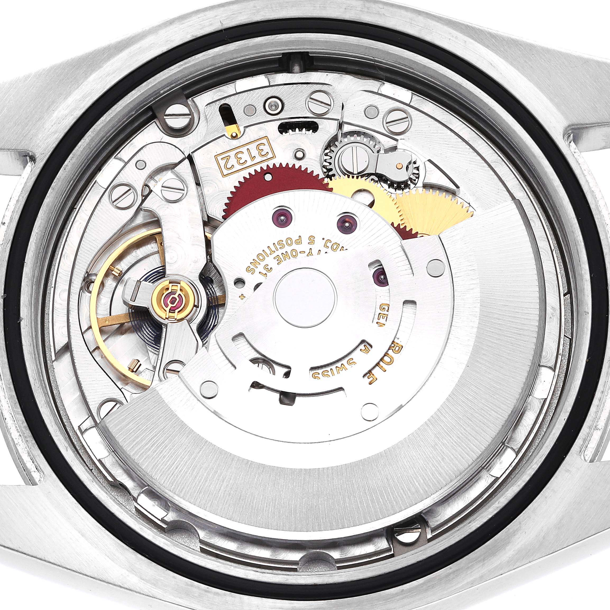 This image shows the internal mechanism of a Rolex Oyster Perpetual 114300 Men's Stainless Steel Blue Dial 114300 Men's Stainless Steel Blue Dial watch from a top-down angle, highlighting its gears and rotor.