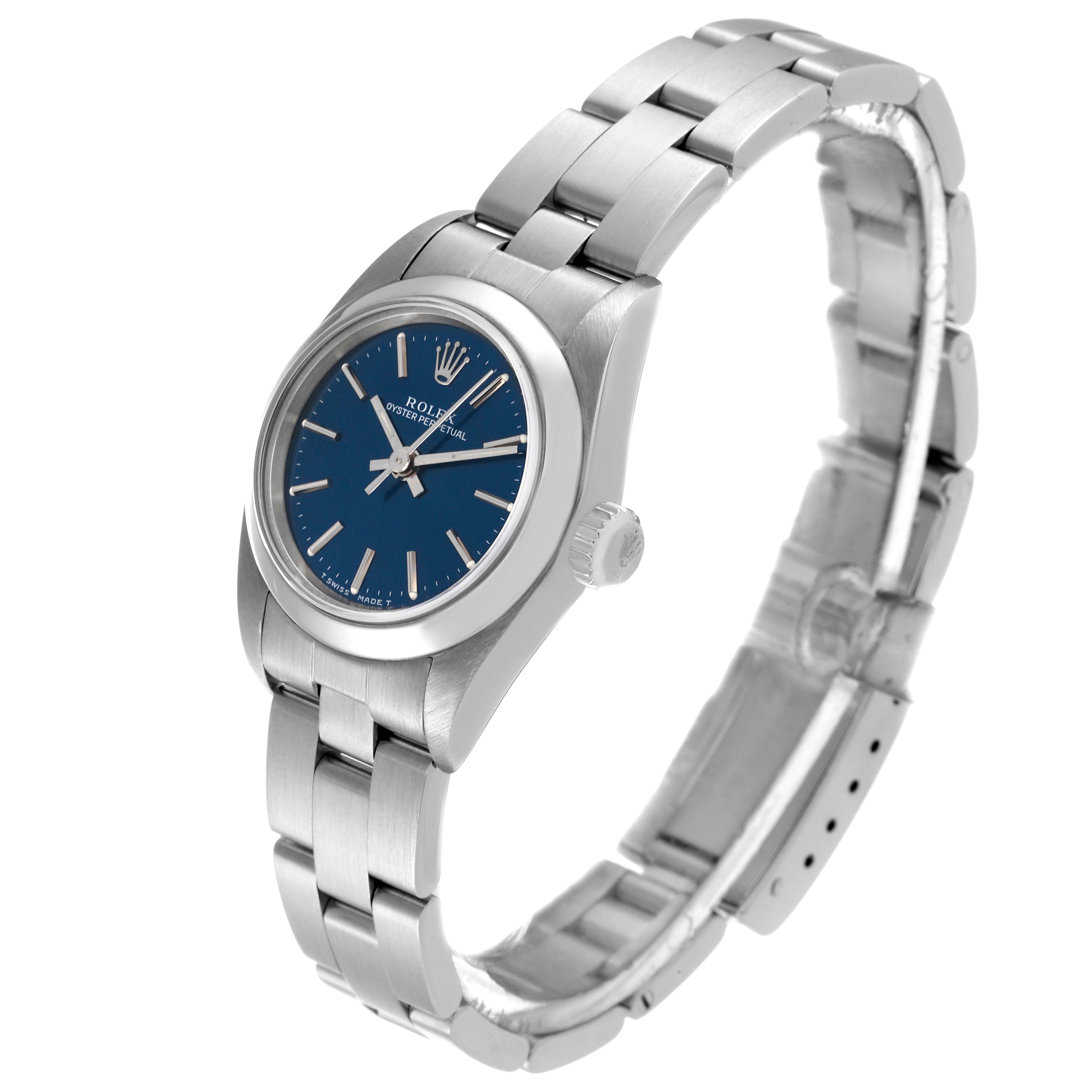 This Rolex Oyster Perpetual 67180 Women's Stainless Steel Blue Dial 67180 Women's Stainless Steel Blue Dial watch is shown at a slight angle, displaying the face, bezel, crown, and bracelet.