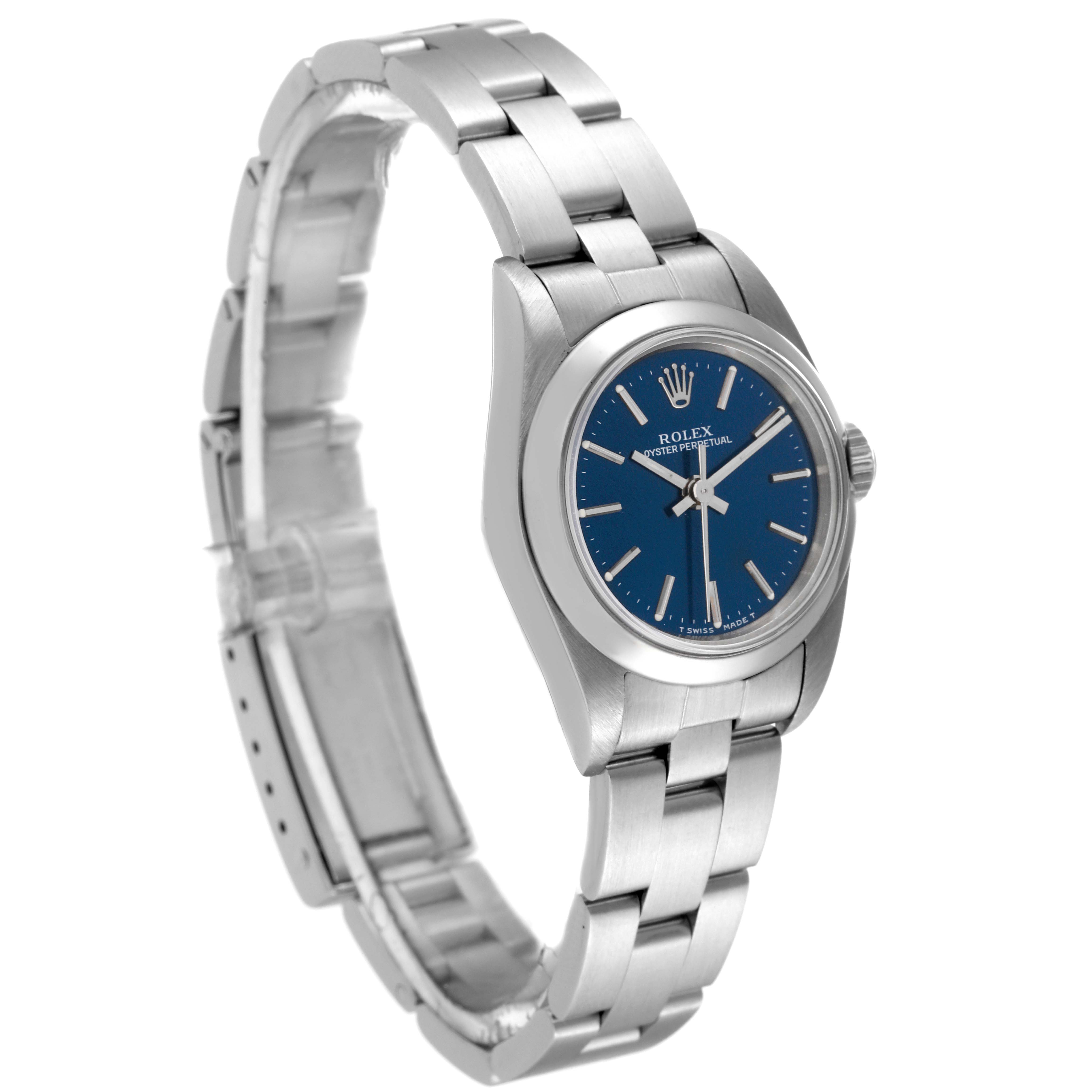 The image shows a side angle of the Rolex Oyster Perpetual 67180 Women's Stainless Steel Blue Dial 67180 Women's Stainless Steel Blue Dial watch, highlighting its blue dial and stainless steel bracelet.