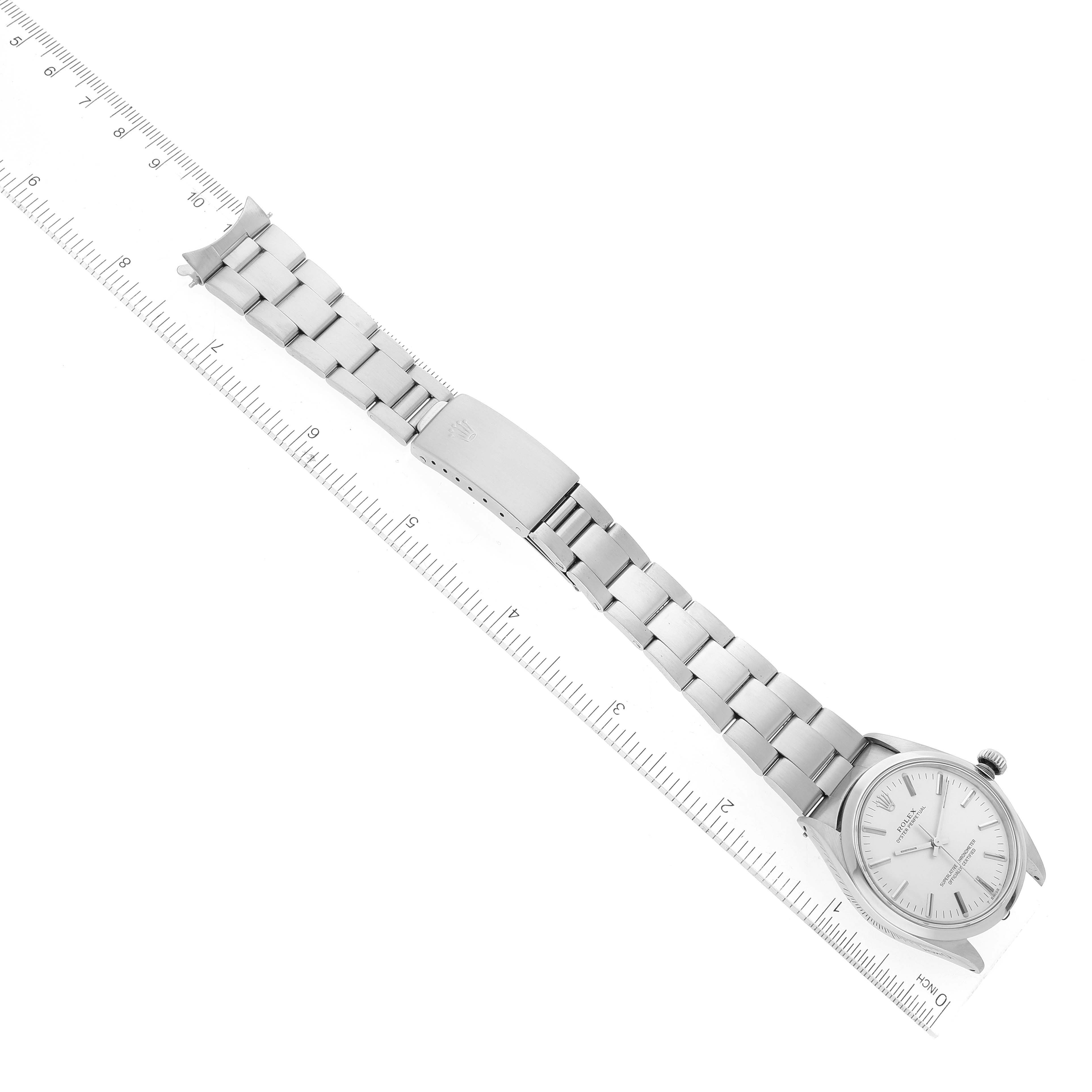 The image shows a bird's-eye view of a Rolex Vintage Collection 1002 Men's Stainless Steel Silver Dial 1002 Men's Stainless Steel Silver Dial watch, prominently displaying its bracelet and clasp.