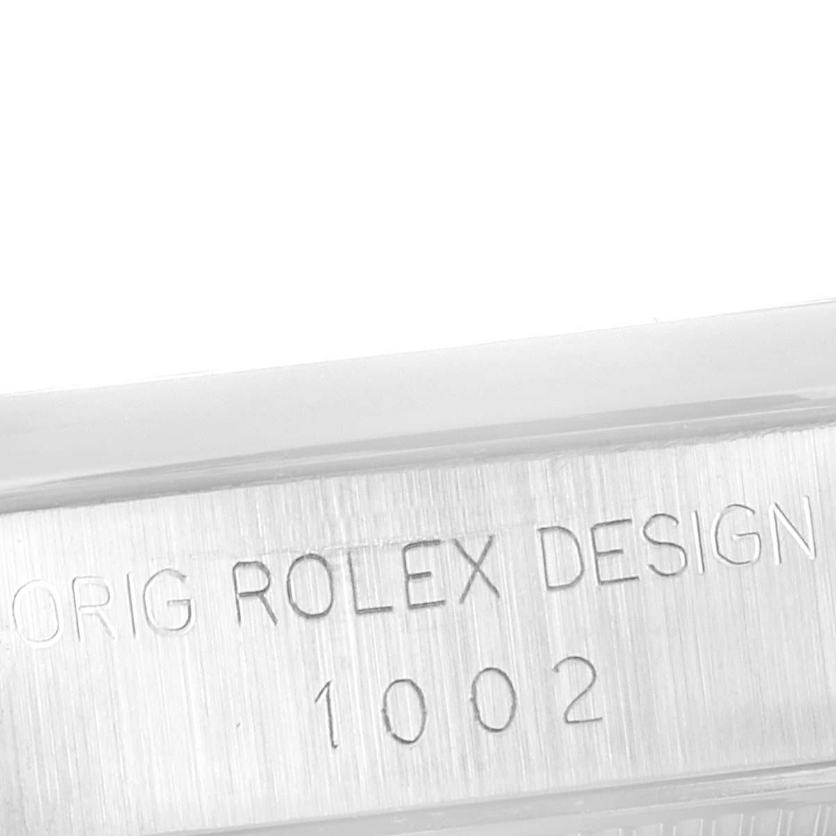 The image shows an engraved side view of a Rolex Vintage Collection 1002 Men's Stainless Steel Silver Dial 1002 Men's Stainless Steel Silver Dial watch case, highlighting the model number 1002.