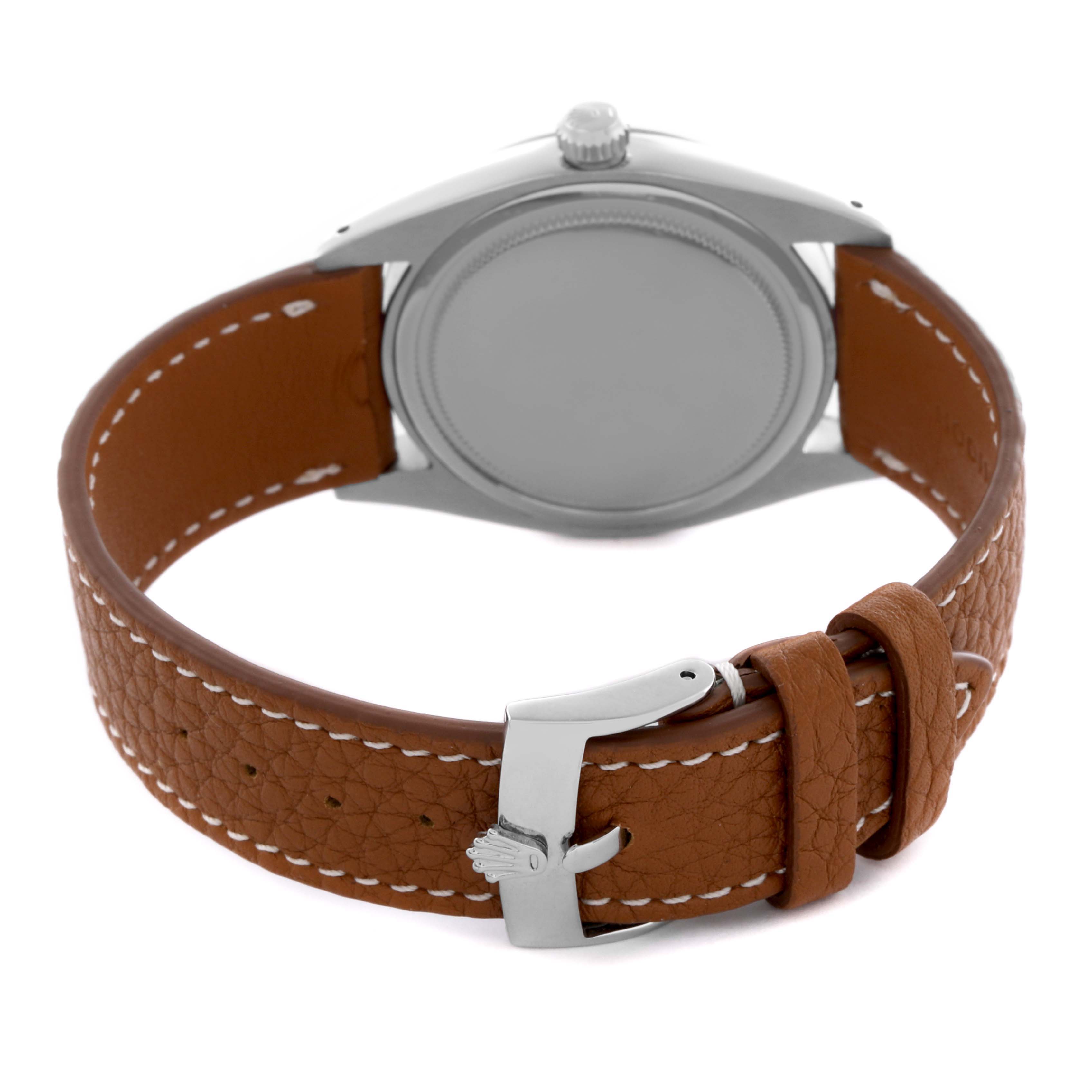 The Rolex Date 6694 Men's Stainless Steel Silver Dial 6694 Men's Stainless Steel Silver Dial model is shown from the back, highlighting the watch case and brown leather strap with a buckle.