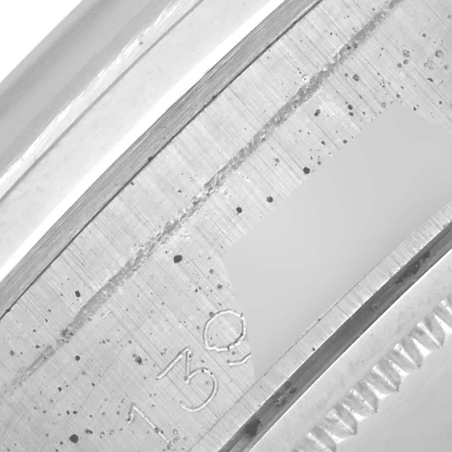 The image shows a close-up of the inner bezel and rehaut of a Rolex Date 6694 Men's Stainless Steel Silver Dial 6694 Men's Stainless Steel Silver Dial model.