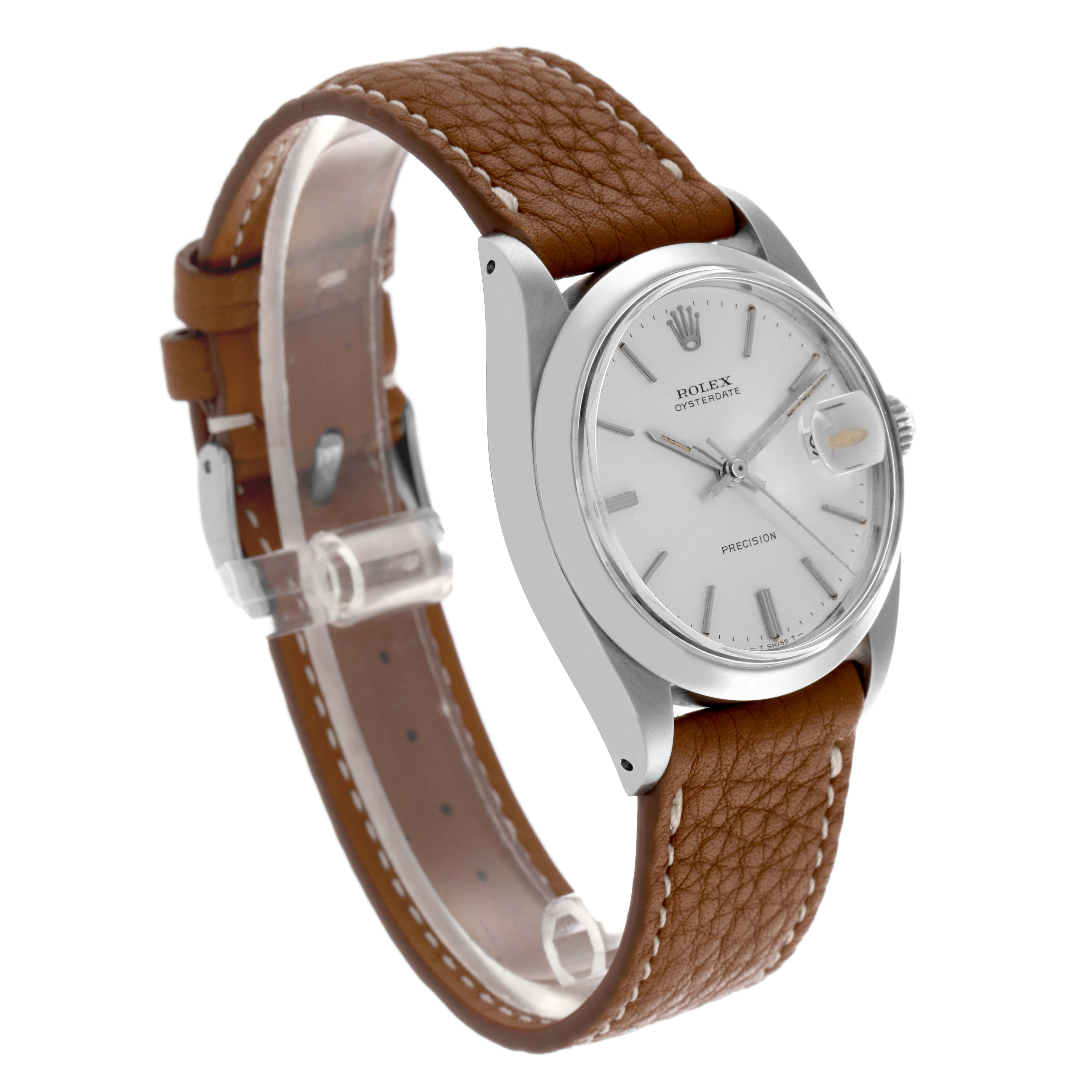 The Rolex Date 6694 Men's Stainless Steel Silver Dial 6694 Men's Stainless Steel Silver Dial watch is shown at a three-quarter angle, displaying the face, bezel, crown, and brown leather strap.