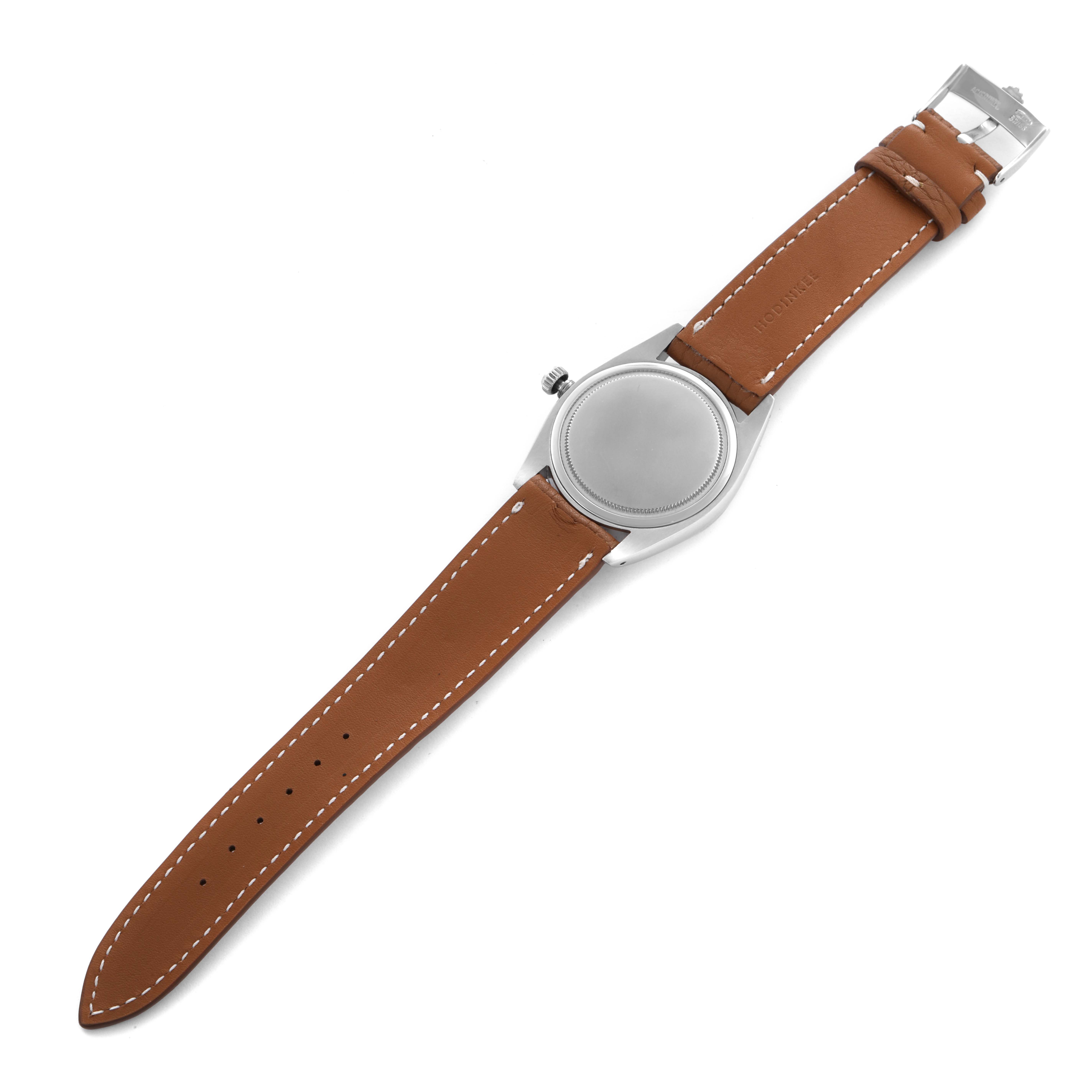 The image shows the back view of a Rolex Date 6694 Men's Stainless Steel Silver Dial 6694 Men's Stainless Steel Silver Dial model watch with a brown leather strap and metal clasp.