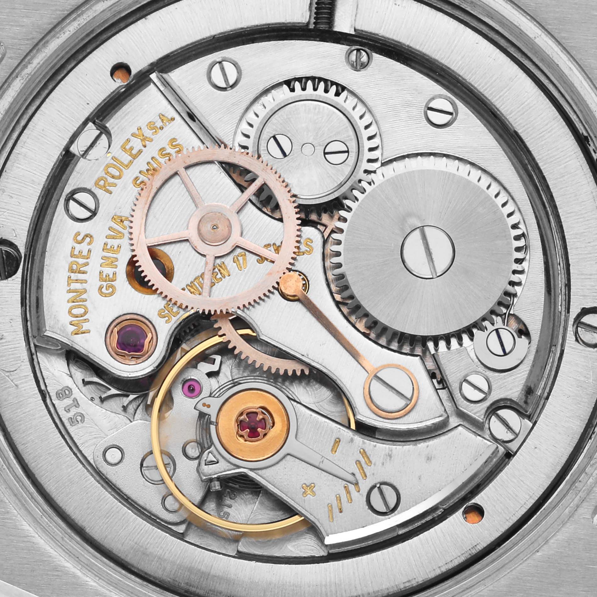 The image shows the intricate movement parts of a Rolex Date 6694 Men's Stainless Steel Silver Dial 6694 Men's Stainless Steel Silver Dial model watch from a top-down angle.