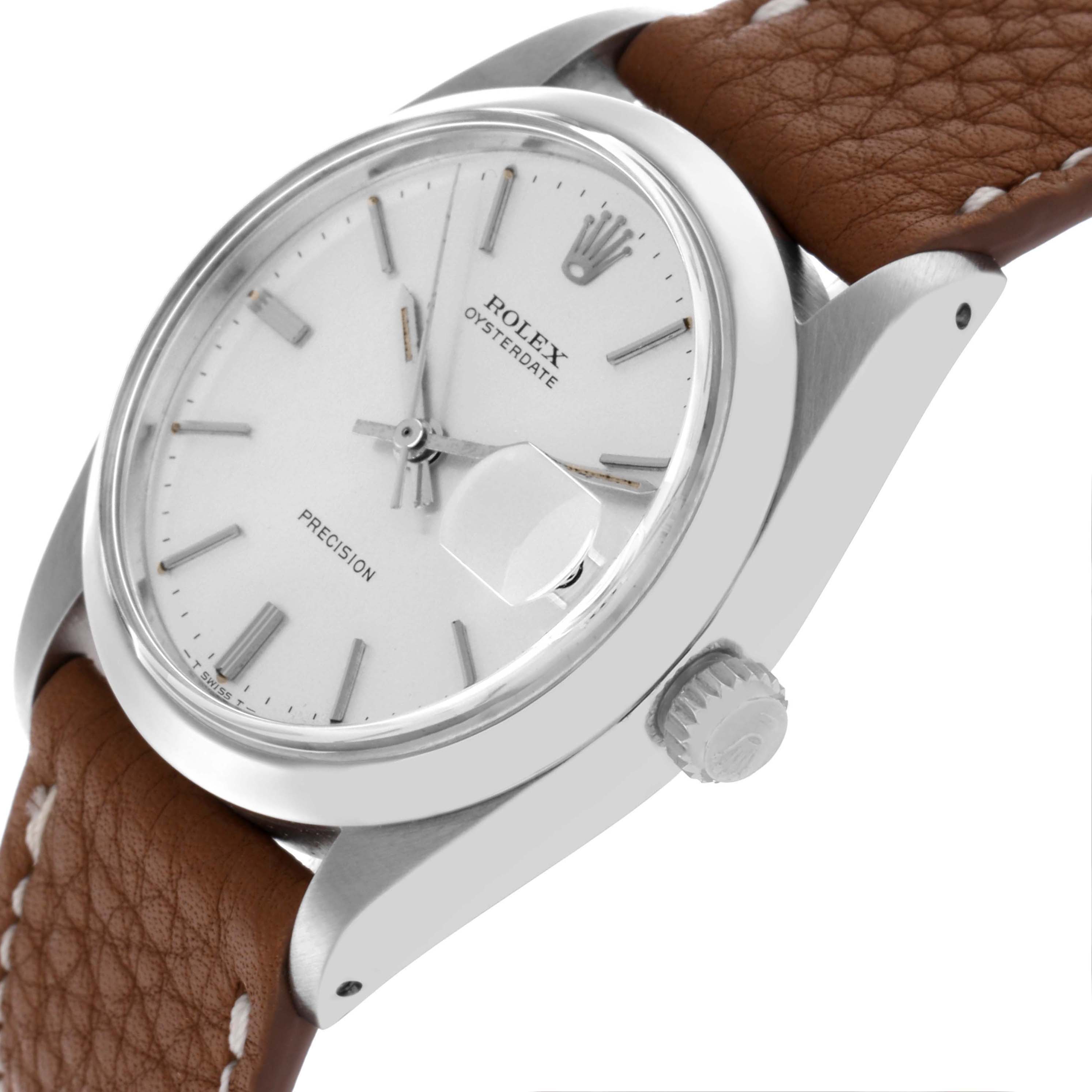The Rolex Date 6694 Men's Stainless Steel Silver Dial 6694 Men's Stainless Steel Silver Dial watch is shown from a side angle, highlighting the dial, case, crown, and brown leather strap.