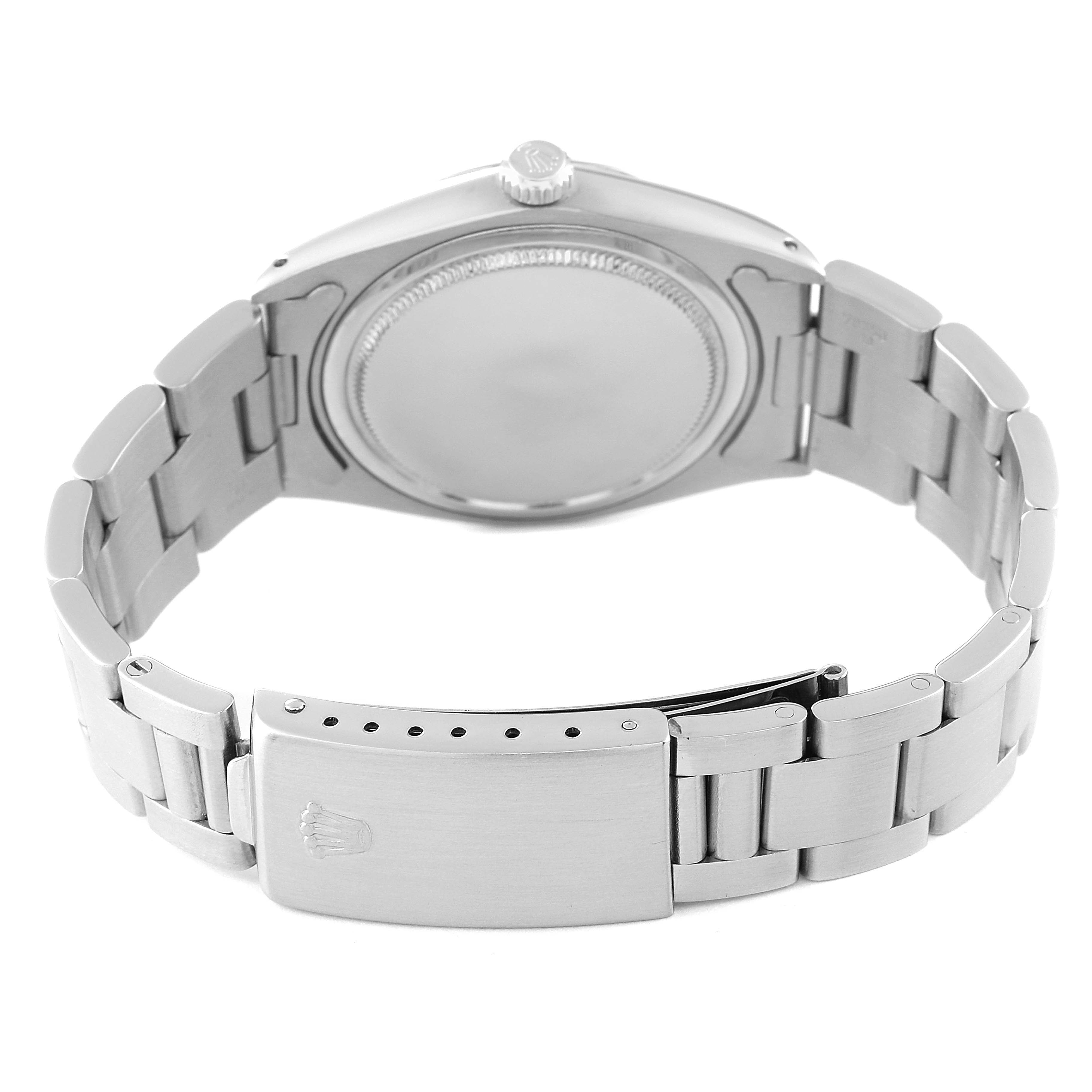 The image shows the back view of a Rolex Vintage Collection 6694 Men's Stainless Steel Silver Dial 6694 Men's Stainless Steel Silver Dial watch, highlighting its case back and bracelet with the clasp open.