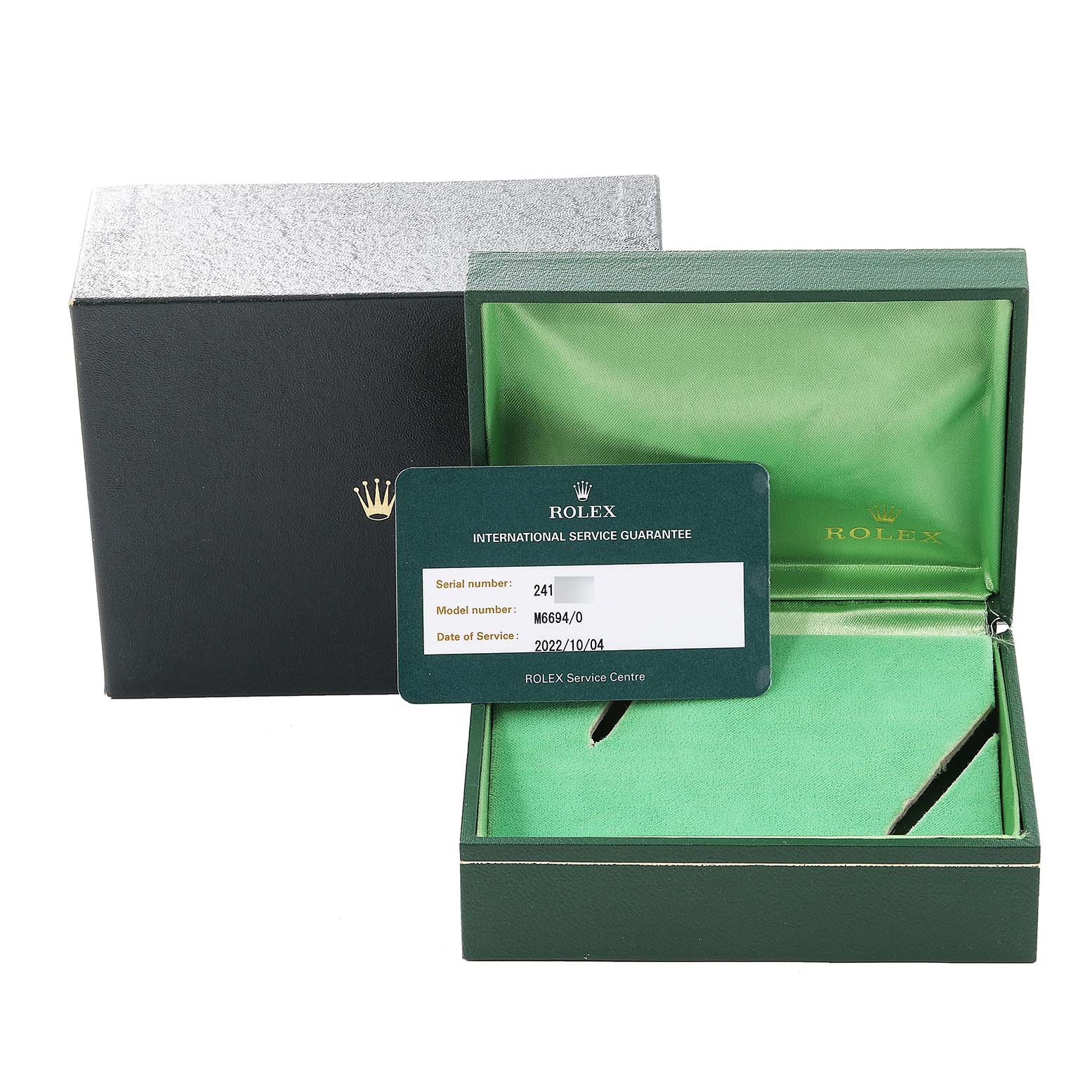 The image shows the packaging of the Rolex Vintage Collection 6694 Men's Stainless Steel Silver Dial 6694 Men's Stainless Steel Silver Dial model with an open green box and a service guarantee card.