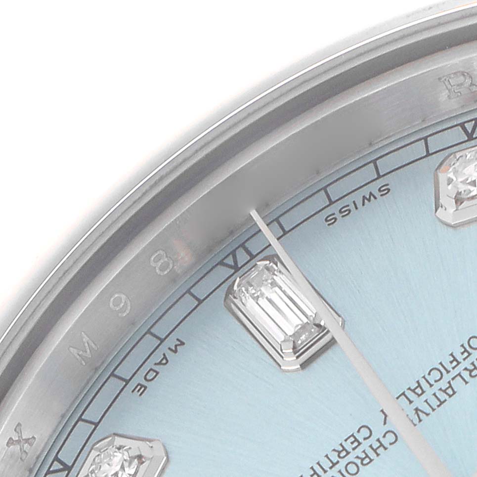 This close-up image of the Rolex President 218206 Men's Platinum Blue Dial model shows a portion of the blue dial, bezel, and a diamond hour marker.