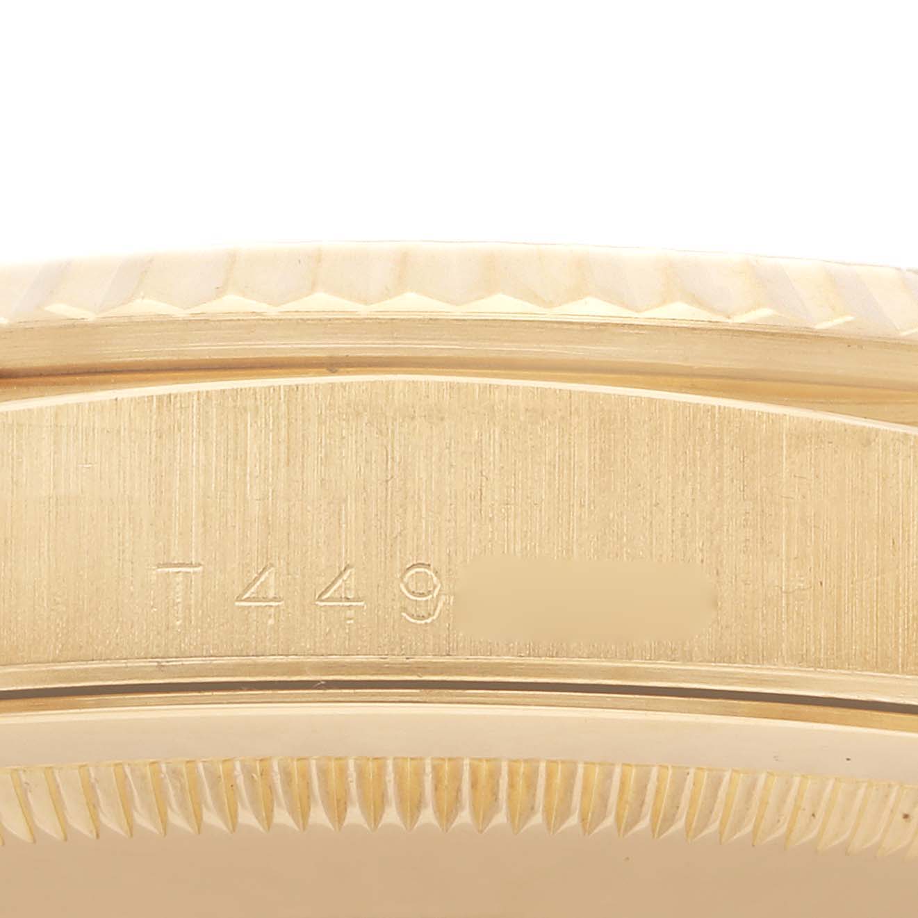 The image shows a close-up of the edge of the case with the bezel and engravings on a Rolex President 18238 Men's Yellow Gold Champagne Dial 18238 Men's Yellow Gold Champagne Dial model watch.