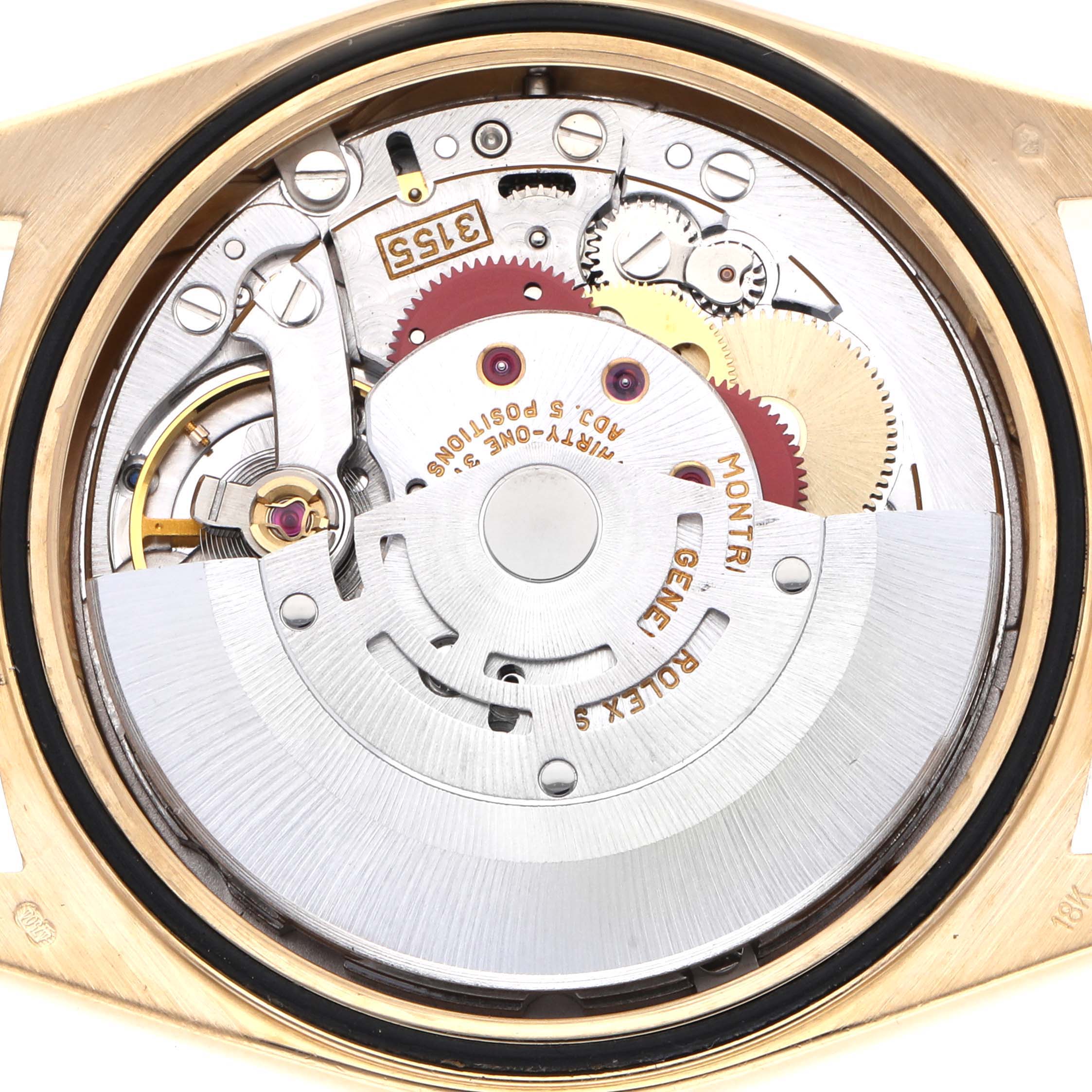 The image shows the movement of a Rolex President 18238 Men's Yellow Gold Champagne Dial 18238 Men's Yellow Gold Champagne Dial model watch, viewed from the back, highlighting gears and the rotor.