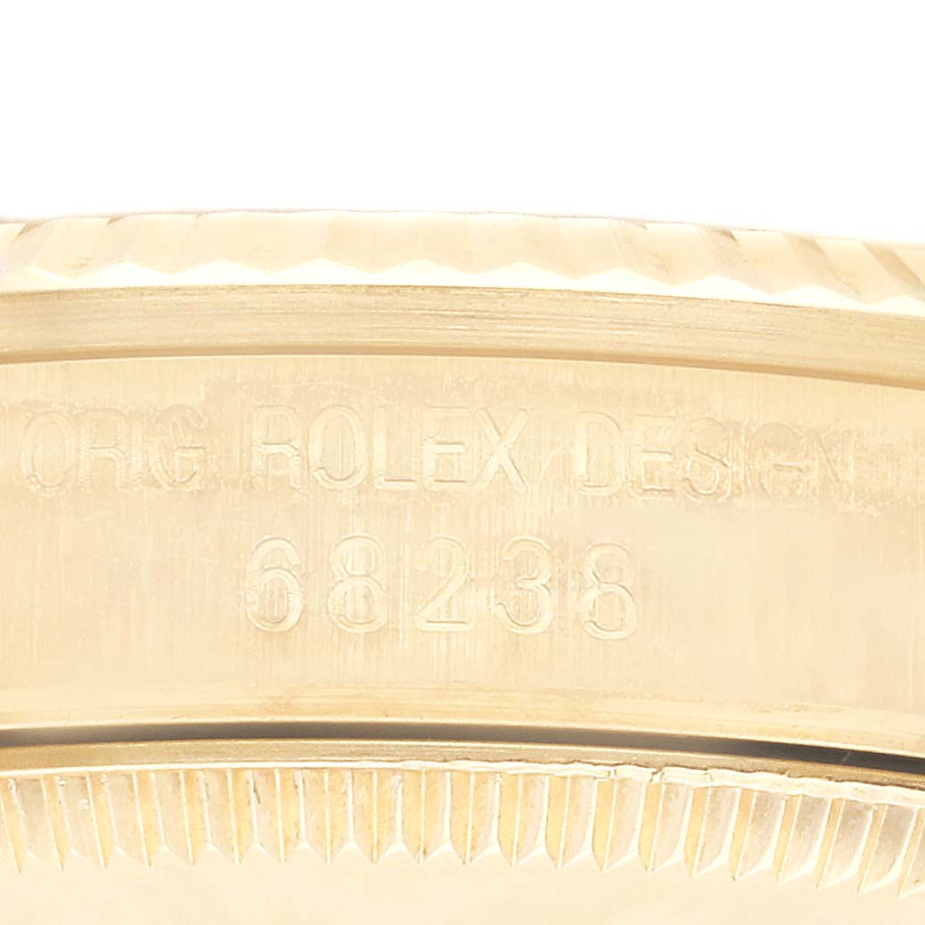 The photo shows an angled close-up of the outer rim and engraved text (model number) on a Rolex President 68238 Women's Yellow Gold Champagne Dial 68238 Women's Yellow Gold Champagne Dial watch.