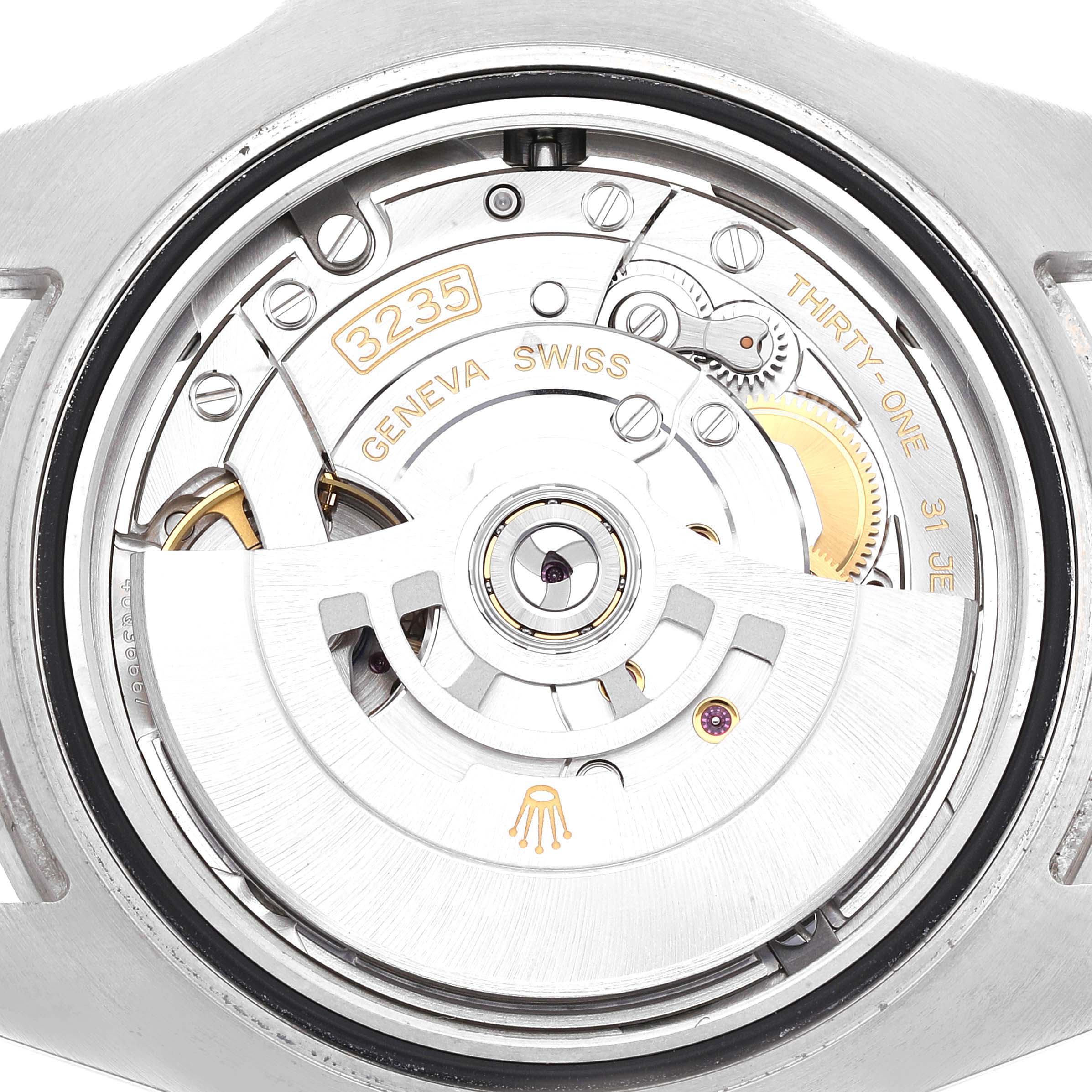 This image shows the case back and automatic movement of a Rolex Submariner 126610 Men
s Stainless Steel Black Dial 126610 Men
s Stainless Steel Black Dial watch, with "3235" and "Geneva Swiss" markings visible.