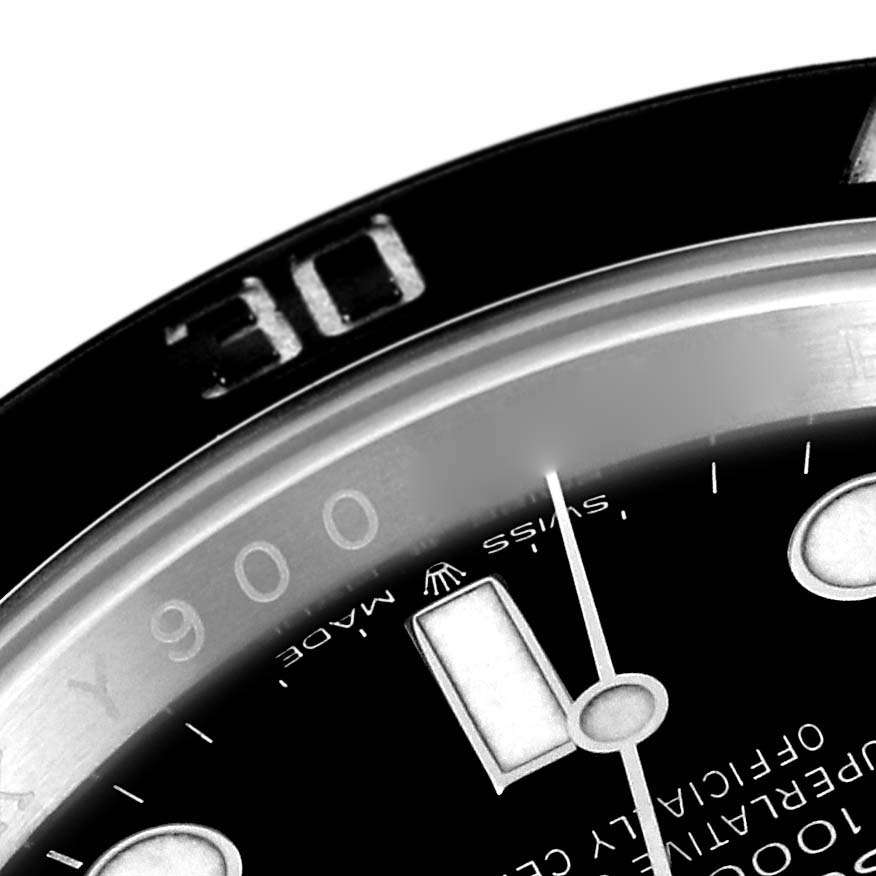 This close-up image of the Rolex Submariner 126610 Men
s Stainless Steel Black Dial 126610 Men
s Stainless Steel Black Dial watch shows part of the bezel, dial, and hour marker.