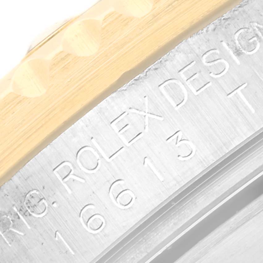The image shows a close-up of the case and bezel with markers of a Rolex Submariner 16613LB Men's Steel and Gold (two tone) Champagne Dial 16613LB Men's Steel and Gold (two tone) Champagne Dial, displaying model number “16613.”