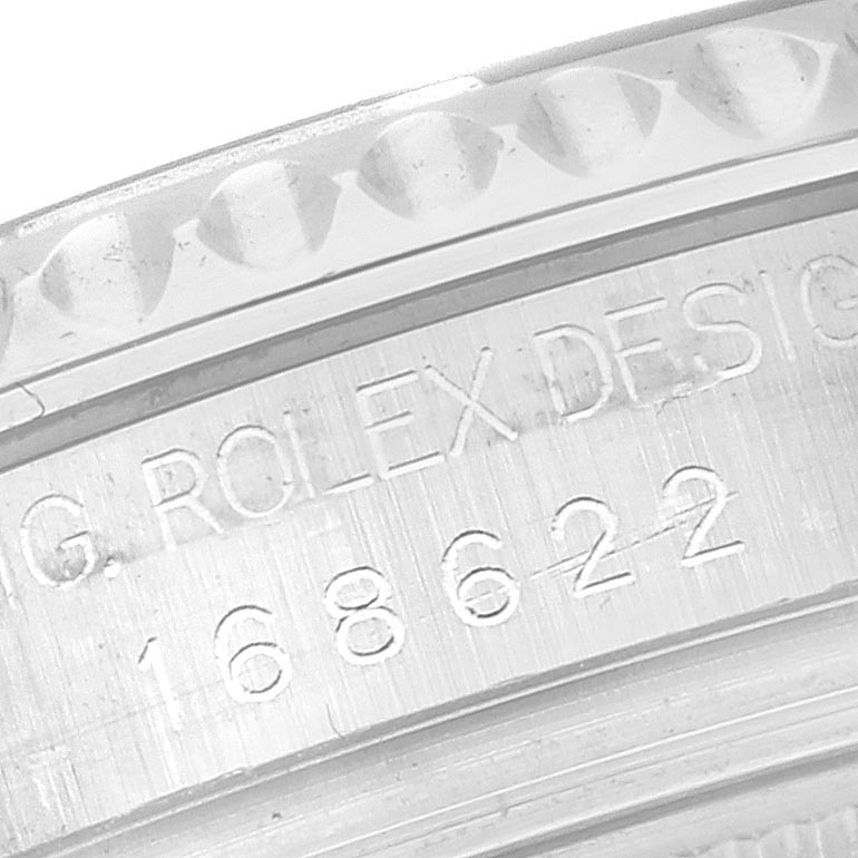 The image shows an angled close-up of the engraved inner bezel of a Rolex Yacht-Master 168622 Men
s Stainless Steel Silver Dial 168622 Men
s Stainless Steel Silver Dial watch.