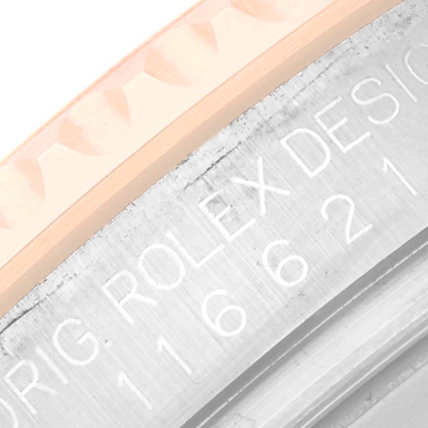 The image shows a close-up of the bezel and engraved casing of a Rolex Yacht-Master 116621 Men's Steel and Gold (two tone) Brown Dial 116621 Men's Steel and Gold (two tone) Brown Dial watch.