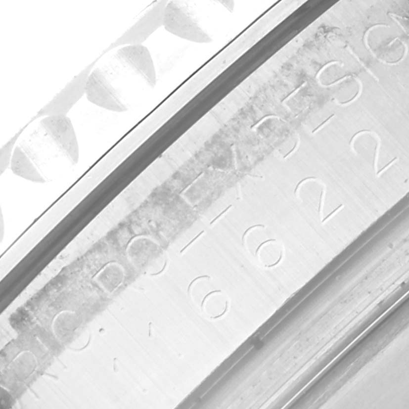 This close-up image shows the engraved inner bezel and part of the textured outer bezel of a Rolex Yacht-Master 116622 Men's Stainless Steel Blue Dial 116622 Men's Stainless Steel Blue Dial watch.