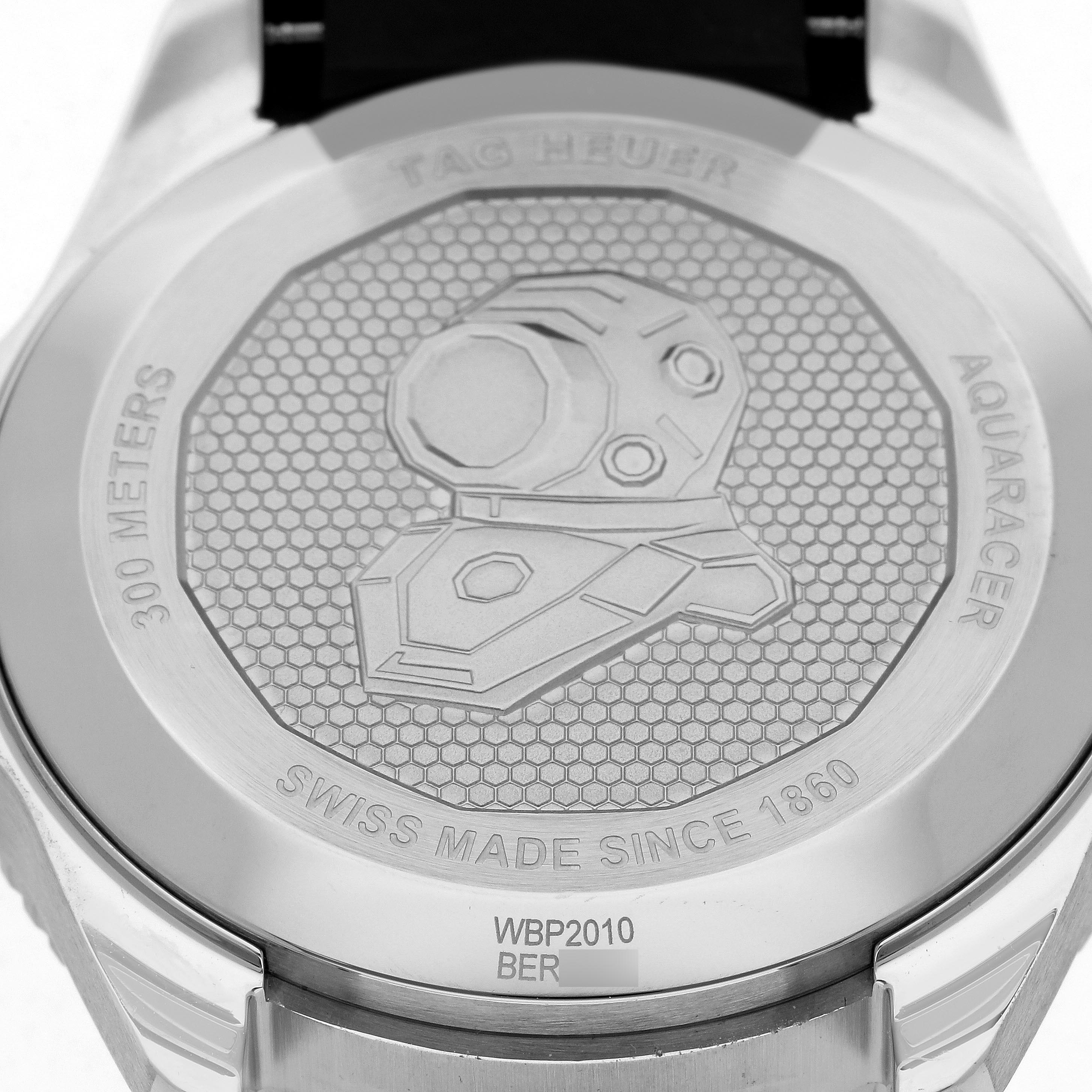 The image shows the back case of a Tag Heuer Aquaracer WBP2010.FT6198 Men's Stainless Steel Blue Dial WBP2010.FT6198 Men's Stainless Steel Blue Dial watch, featuring the logo and specifications.