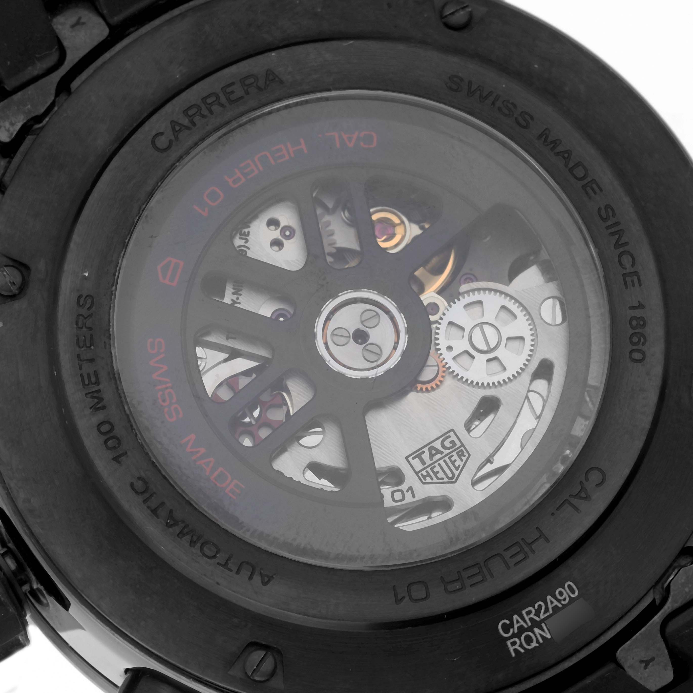 This image shows the back side of the Tag Heuer Carrera CAR2A90.FT6071 Men's Ceramic Black Dial CAR2A90.FT6071 Men's Ceramic Black Dial watch, revealing its internal mechanisms and branding.