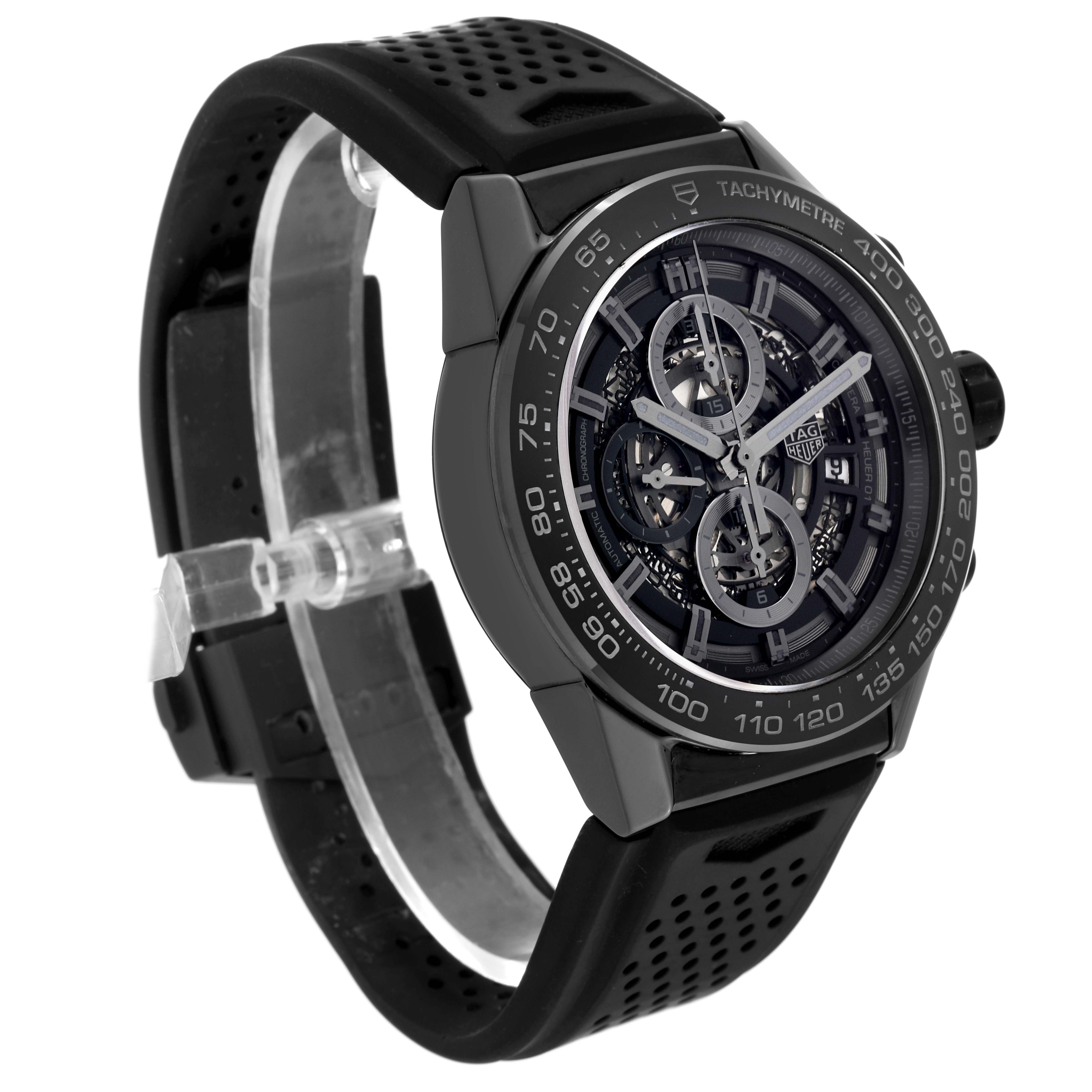 The image shows a diagonal view of a Tag Heuer Carrera CAR2A90.FT6071 Men's Ceramic Black Dial CAR2A90.FT6071 Men's Ceramic Black Dial watch, highlighting its face, bezel, and black perforated strap.