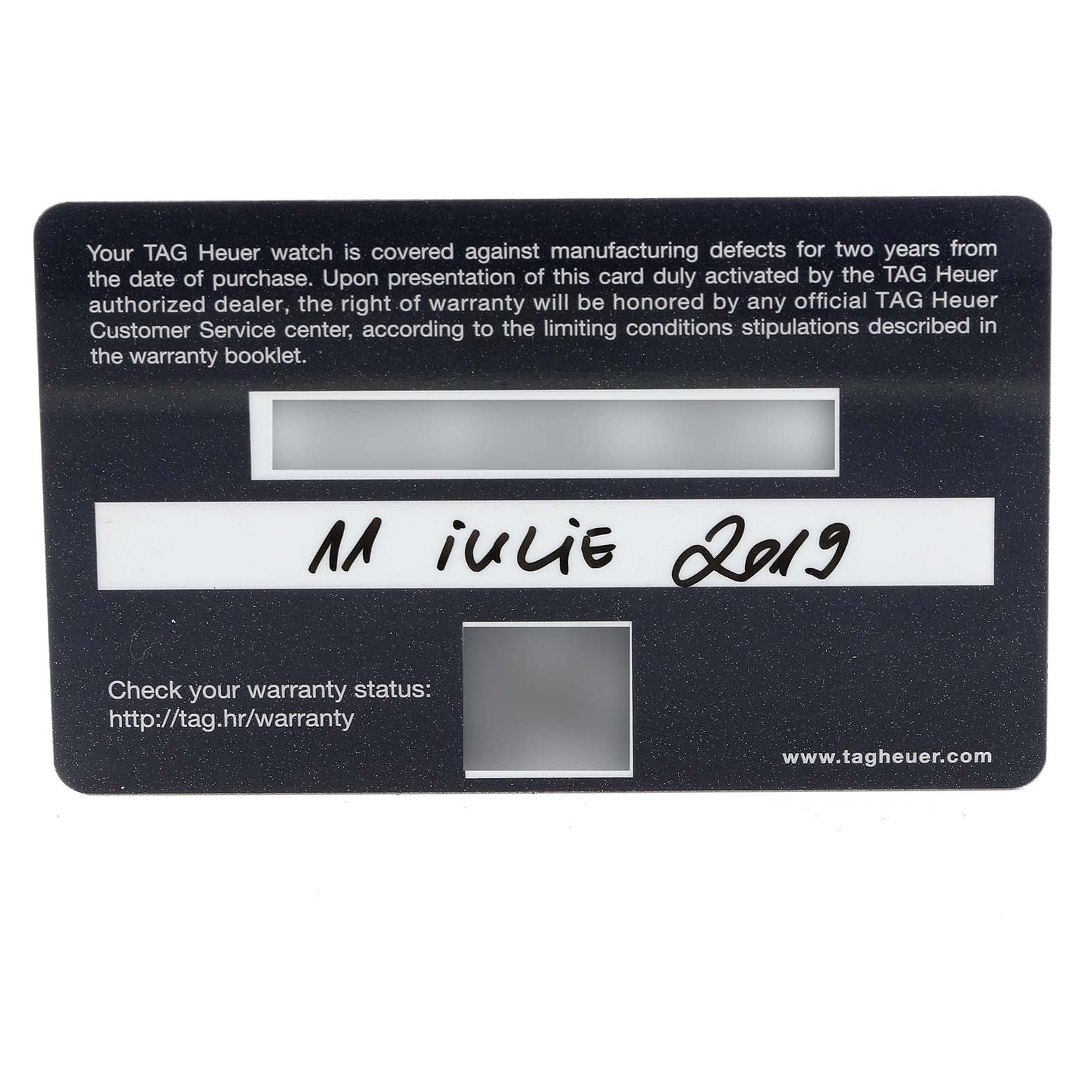 The image shows a Tag Heuer warranty card for the Carrera model, displaying the purchase date.