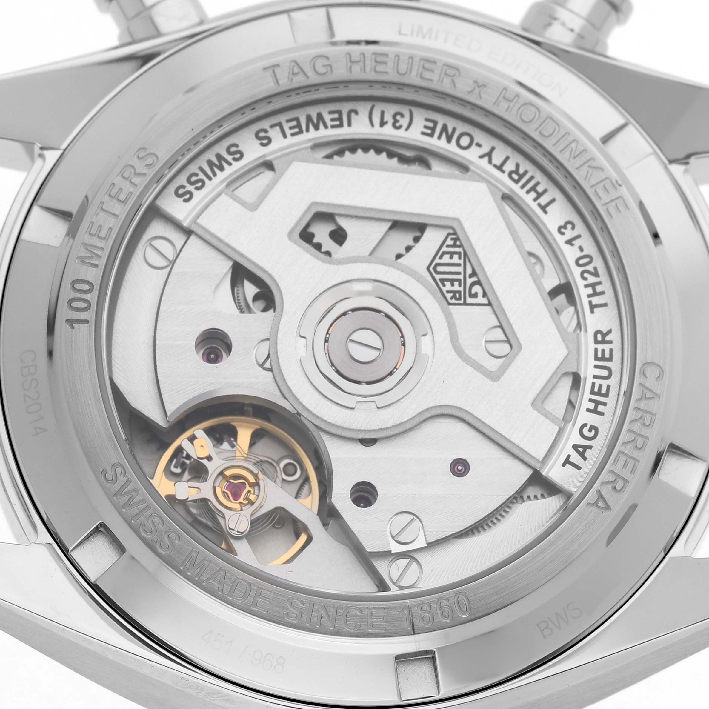 The image shows the back of a Tag Heuer Carrera CBS2014.FT6293 Men's Stainless Steel Black Dial watch, highlighting its intricate mechanical movement.