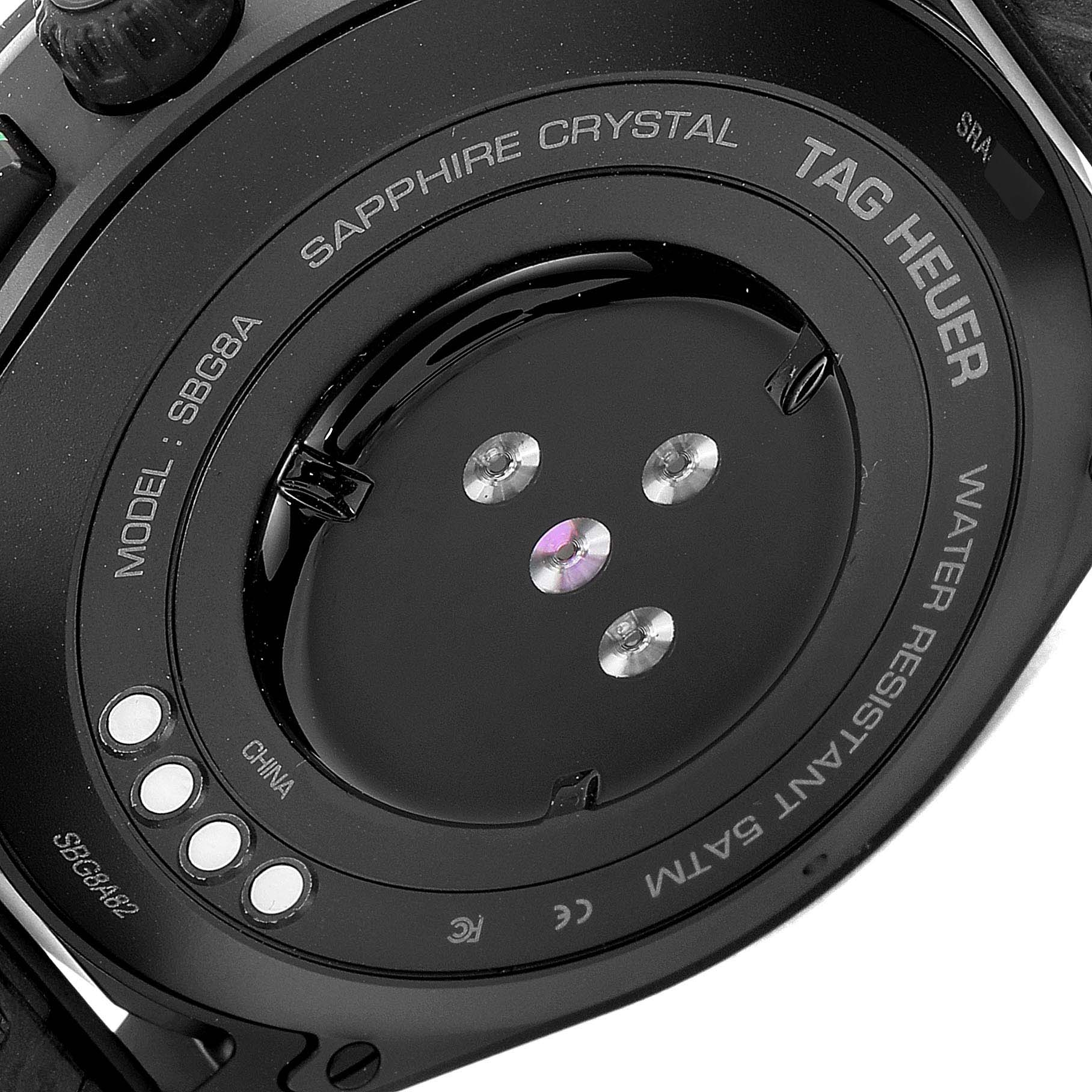 The image shows the rear side of a Tag Heuer Connected SBG8A82.EB0206 Men's Titanium  SBG8A82.EB0206 Men's Titanium  model watch, highlighting the sapphire crystal, model number, and water resistance.