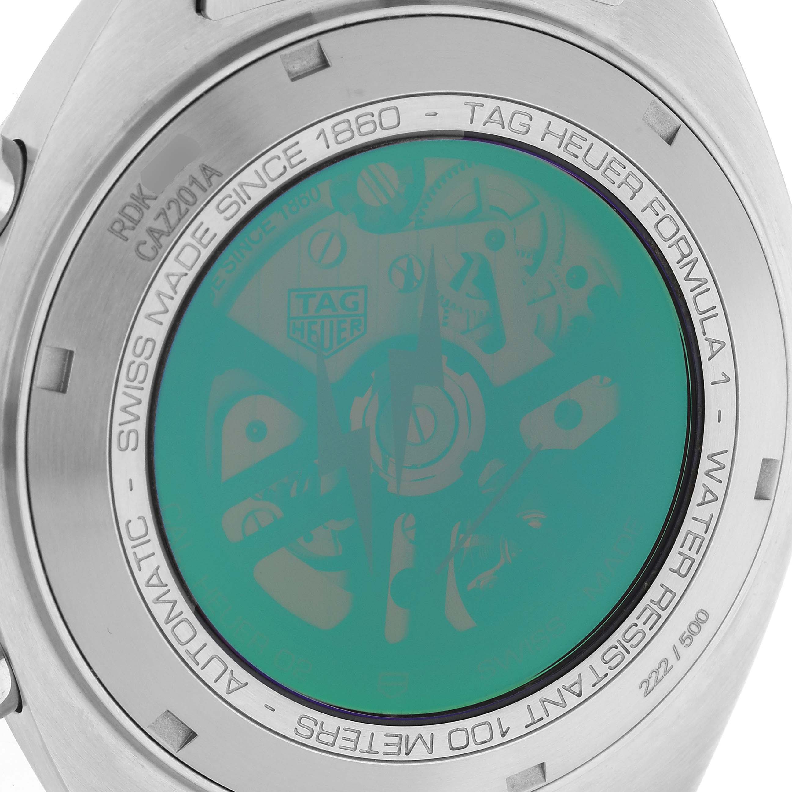 The image shows the back case of the Tag Heuer Formula 1 watch, highlighting inscriptions and a transparent view revealing internal parts.