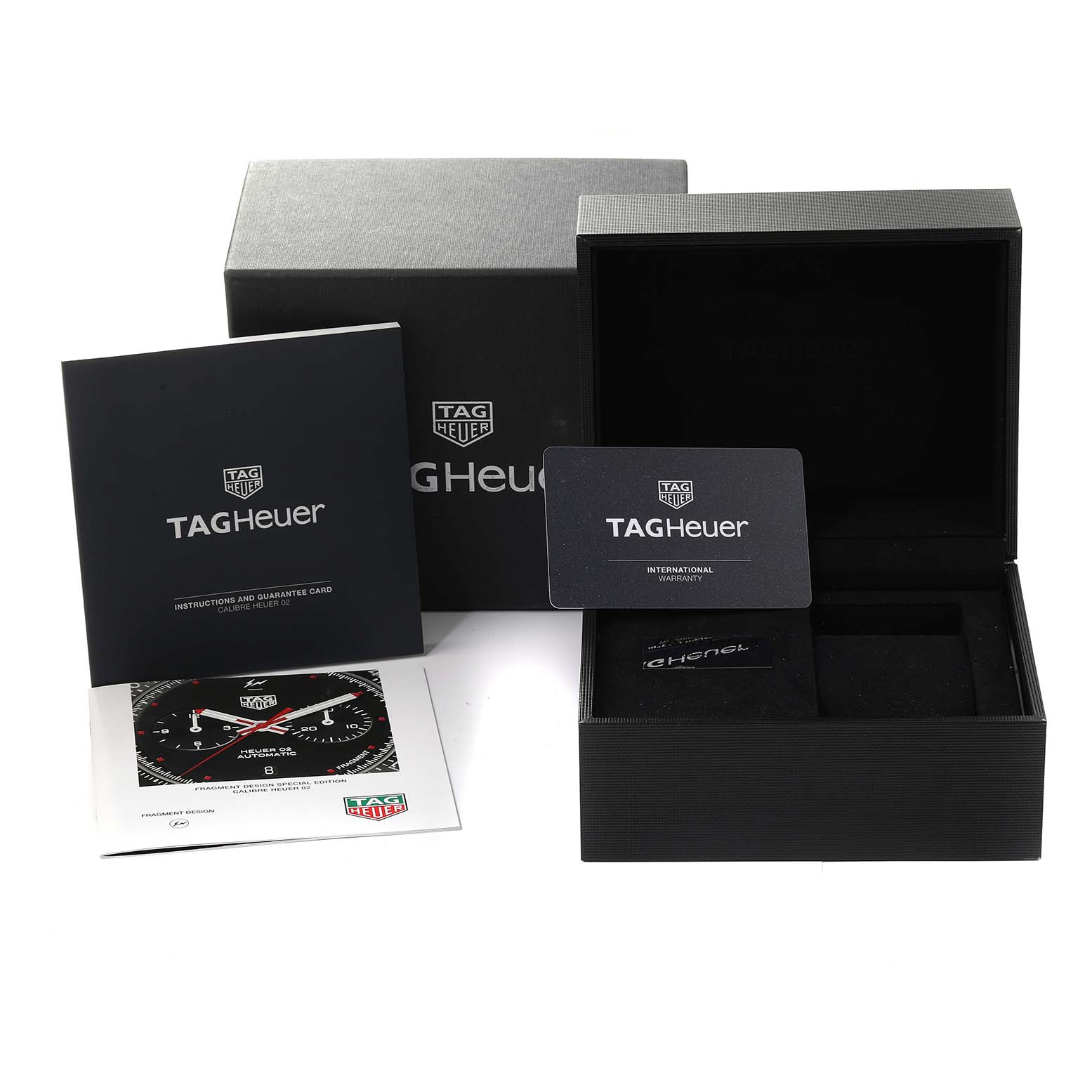 The image shows a Tag Heuer Formula 1 watch's box, international warranty card, instruction manual, and authenticity certificate.