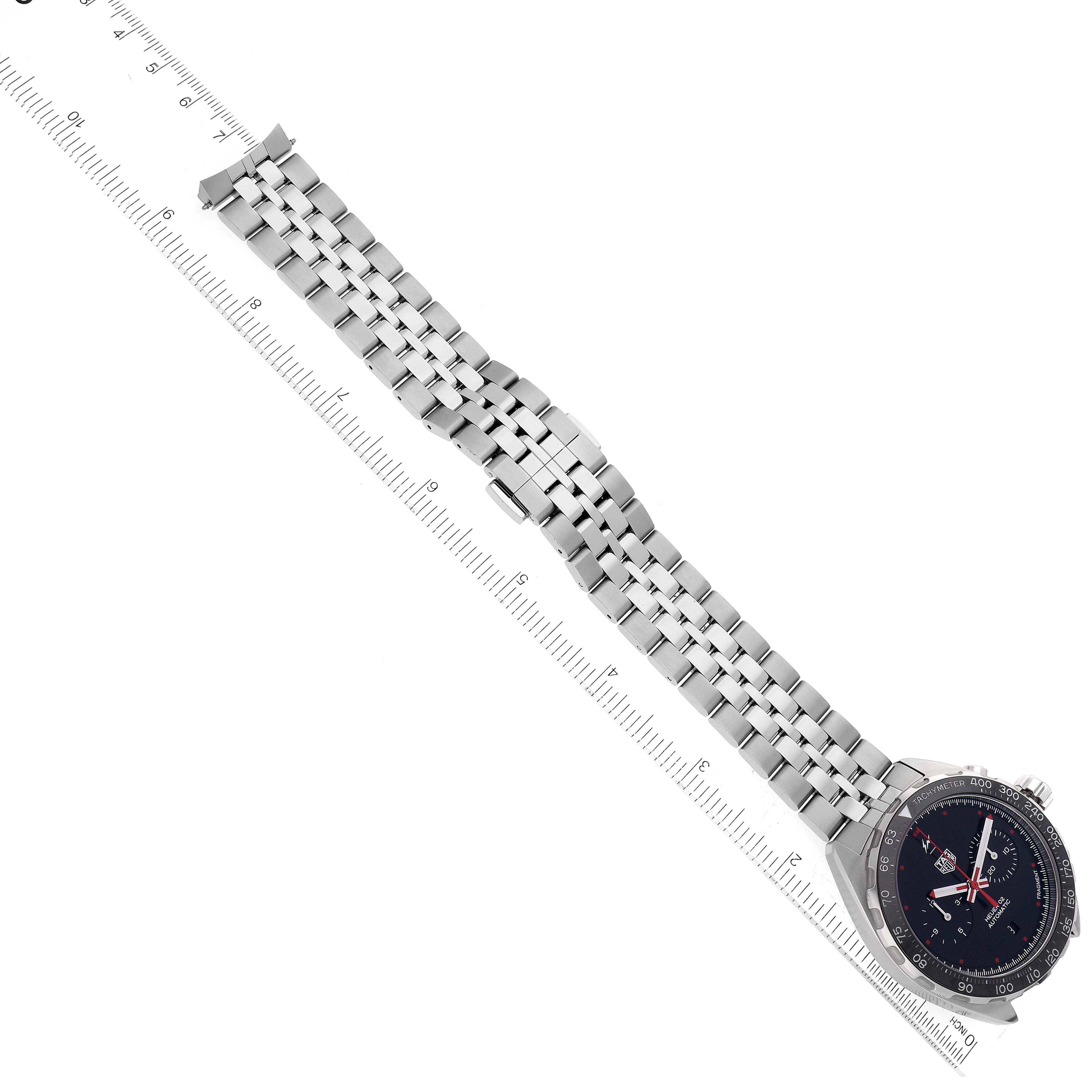 The image shows a top view of the Tag Heuer Formula 1 watch highlighting the face and the full length of the metal bracelet.