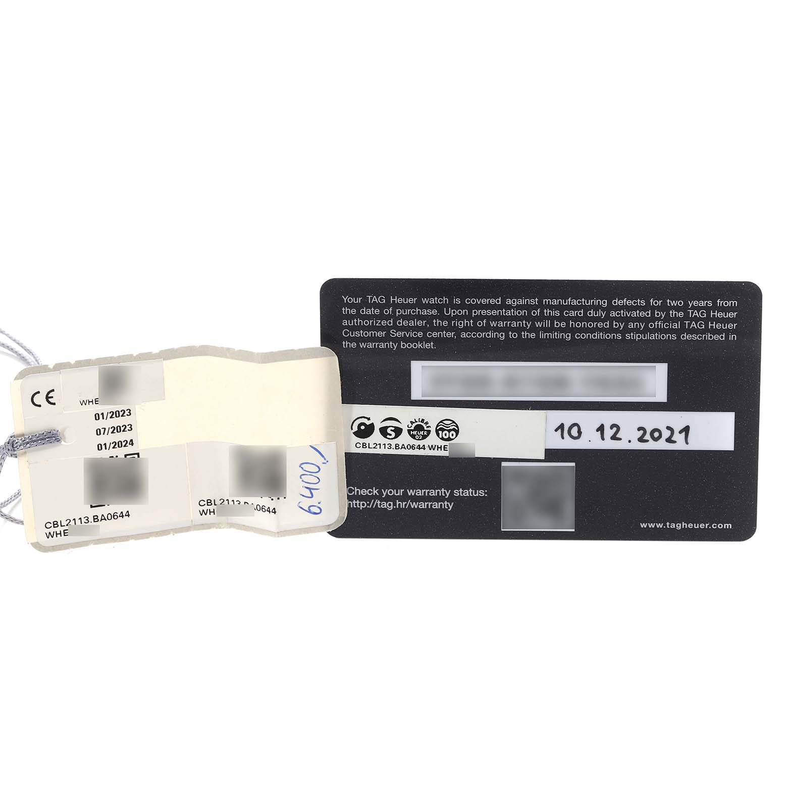 The image shows the warranty card and tags for a Tag Heuer Monaco CBL2113.BA0644 Men's Stainless Steel Black Dial CBL2113.BA0644 Men's Stainless Steel Black Dial watch model, CBL2113.BA0644.