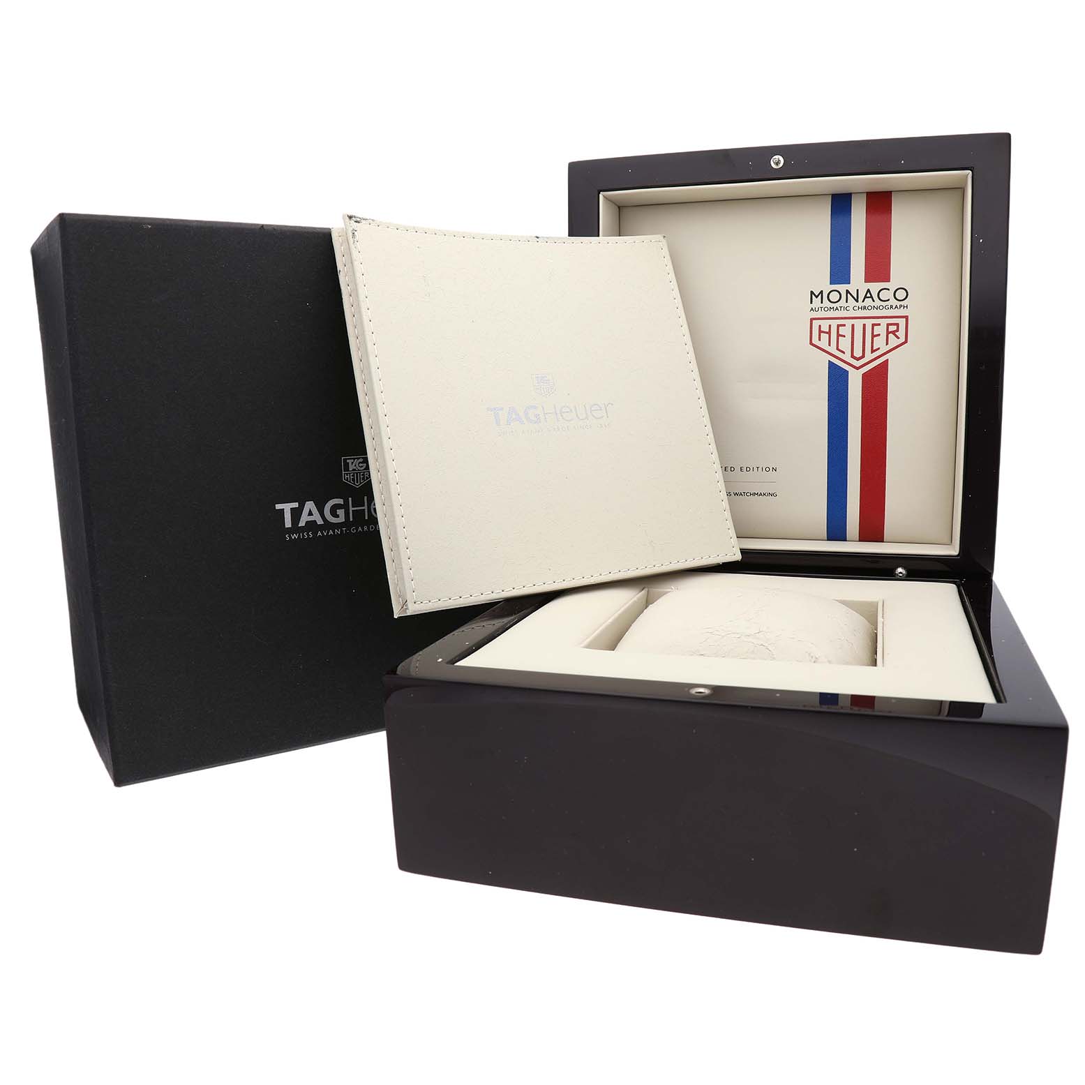 The image shows a Tag Heuer Monaco CW2113 Men's Stainless Steel Blue Dial watch box, open to display its interior with a branded booklet.