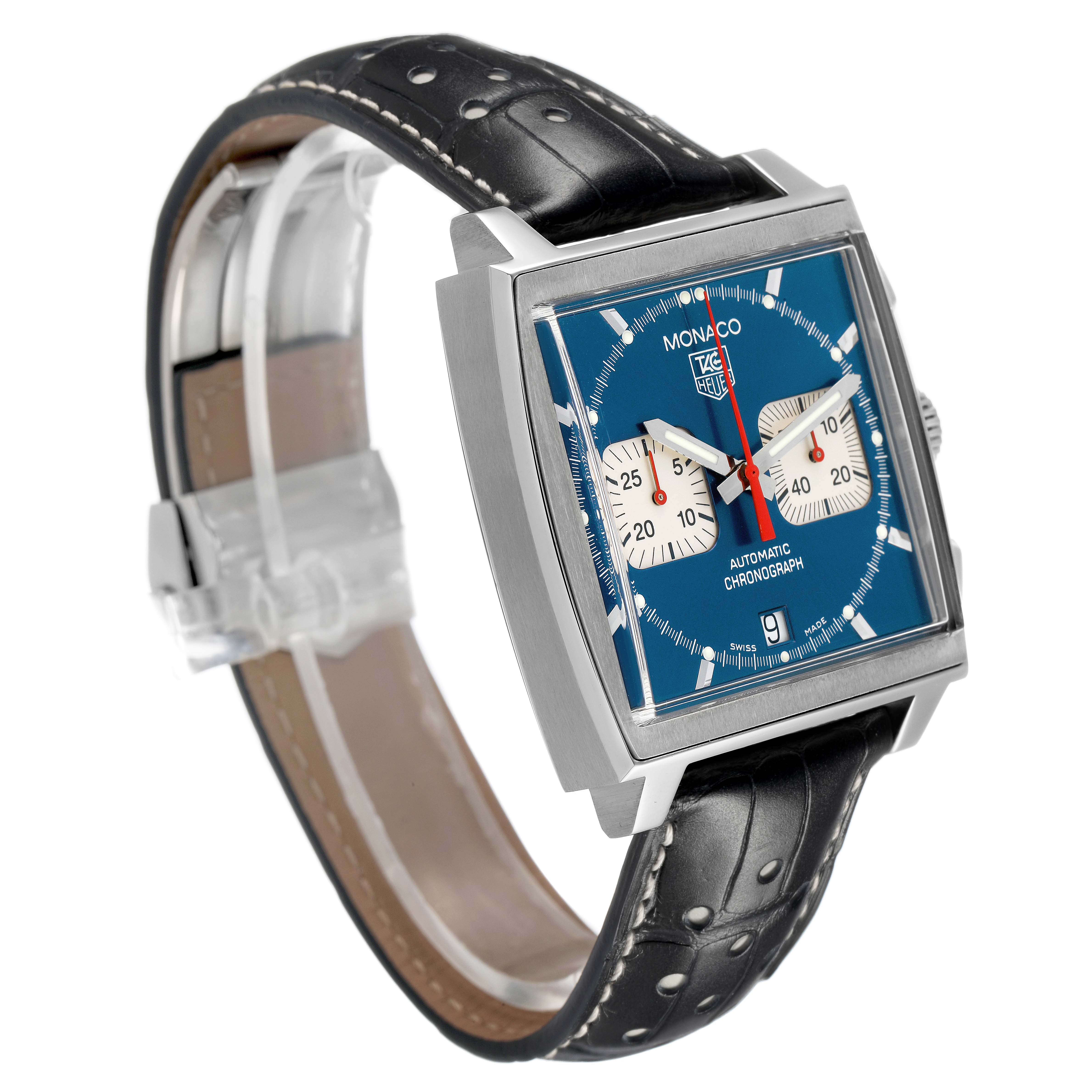 The Tag Heuer Monaco CW2113 Men's Stainless Steel Blue Dial watch is shown at an angled side view, highlighting the square case, blue dial, subdials, and leather strap.