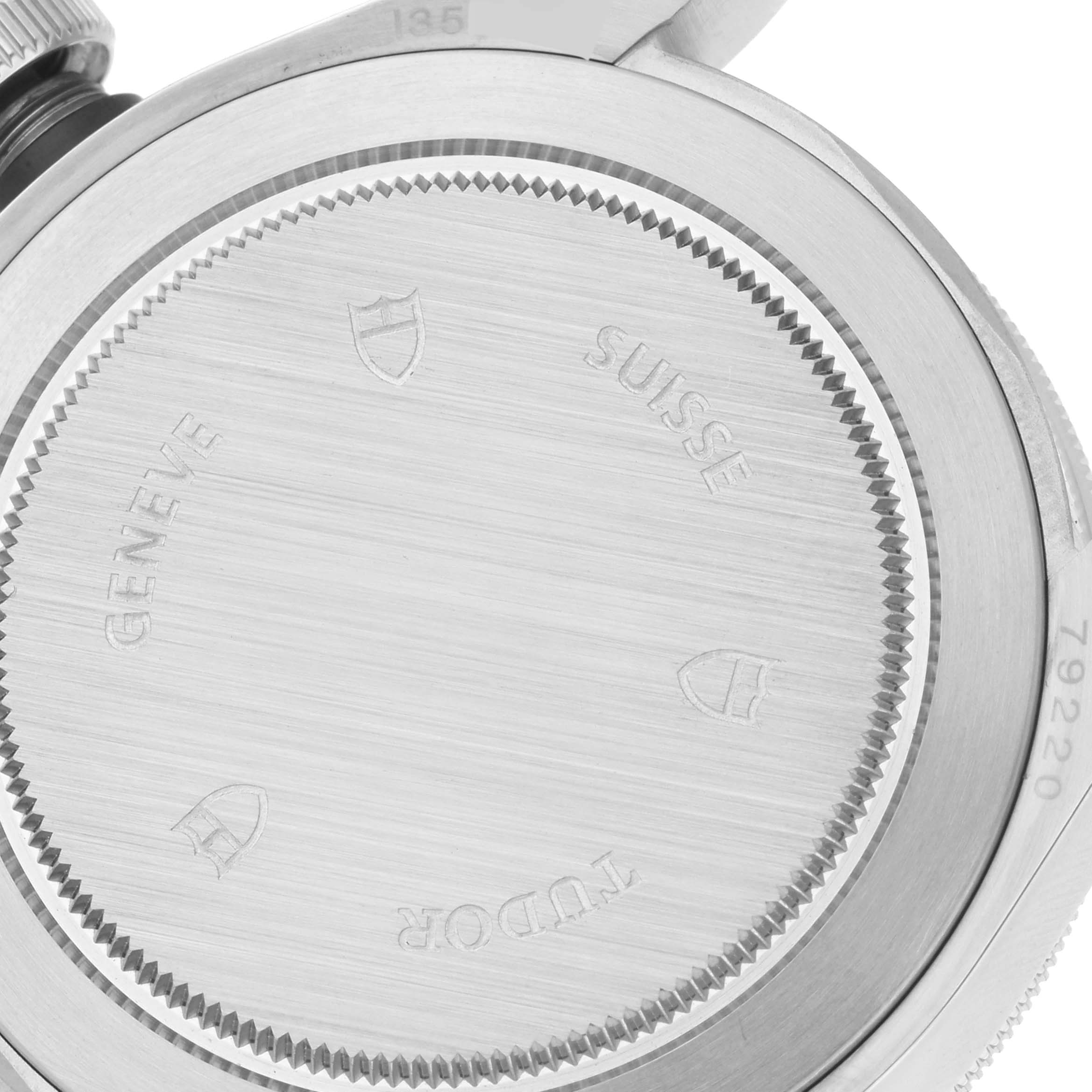 This image shows the back case of a Tudor Heritage Black Bay 79220B Men's Stainless Steel Black Dial 79220B Men's Stainless Steel Black Dial watch, viewed closely to display engravings and details.