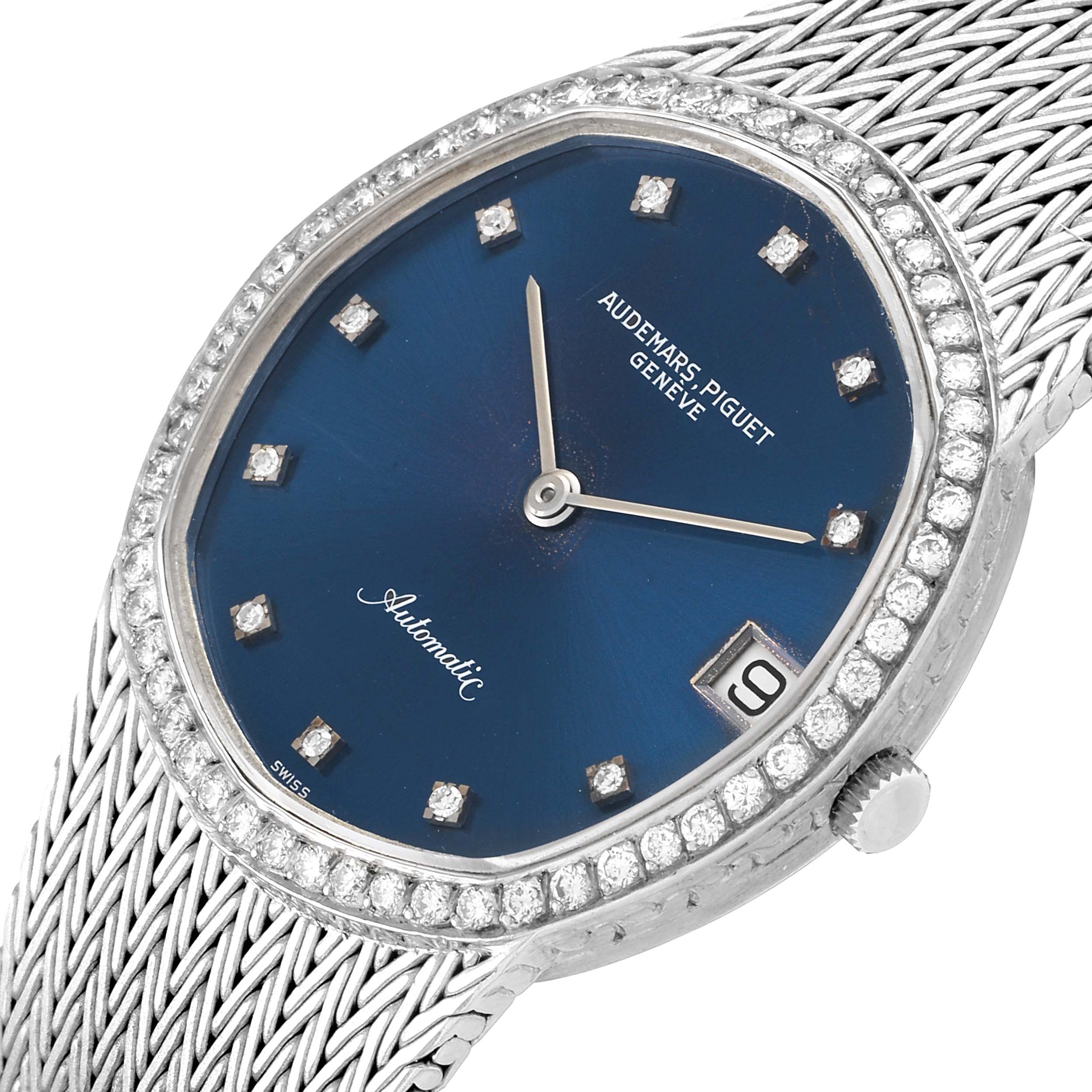 The image shows a close-up, angled view of a Vintage Audemars Piguet watch, highlighting its blue dial, diamond indices, and mesh bracelet.