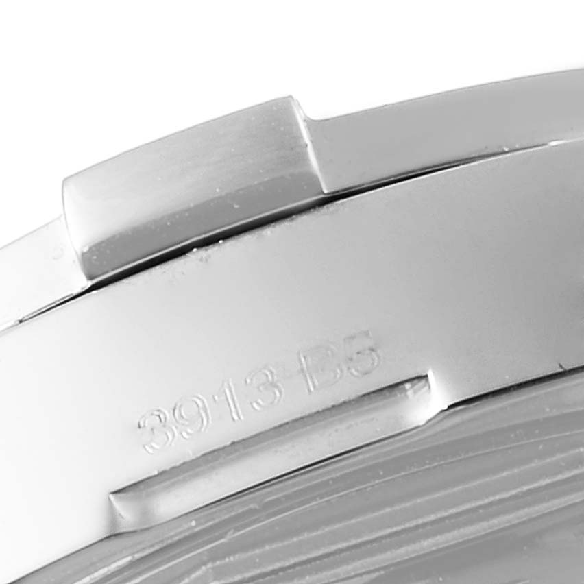 This image shows a close-up of the side of a Breitling Avenger A3239011-C872-170A Men
s Stainless Steel Blue Dial A3239011-C872-170A Men
s Stainless Steel Blue Dial watch, focusing on part of the clasp and case with a visible serial number.