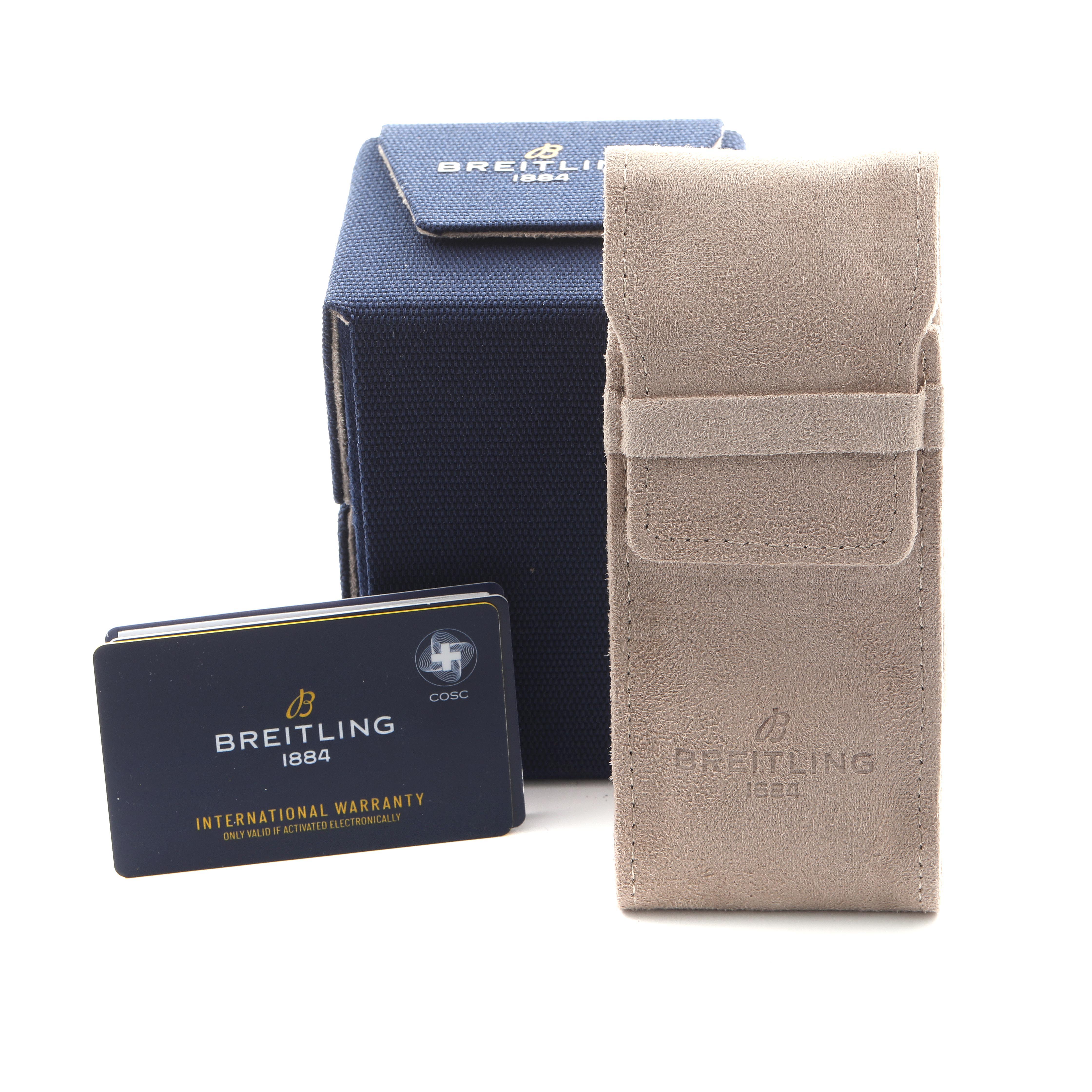 The image shows the Breitling Aviator R23380 Men's Rose Gold Grey Dial R23380 Men's Rose Gold Grey Dial's accessories: a box, warranty card, and suede pouch.