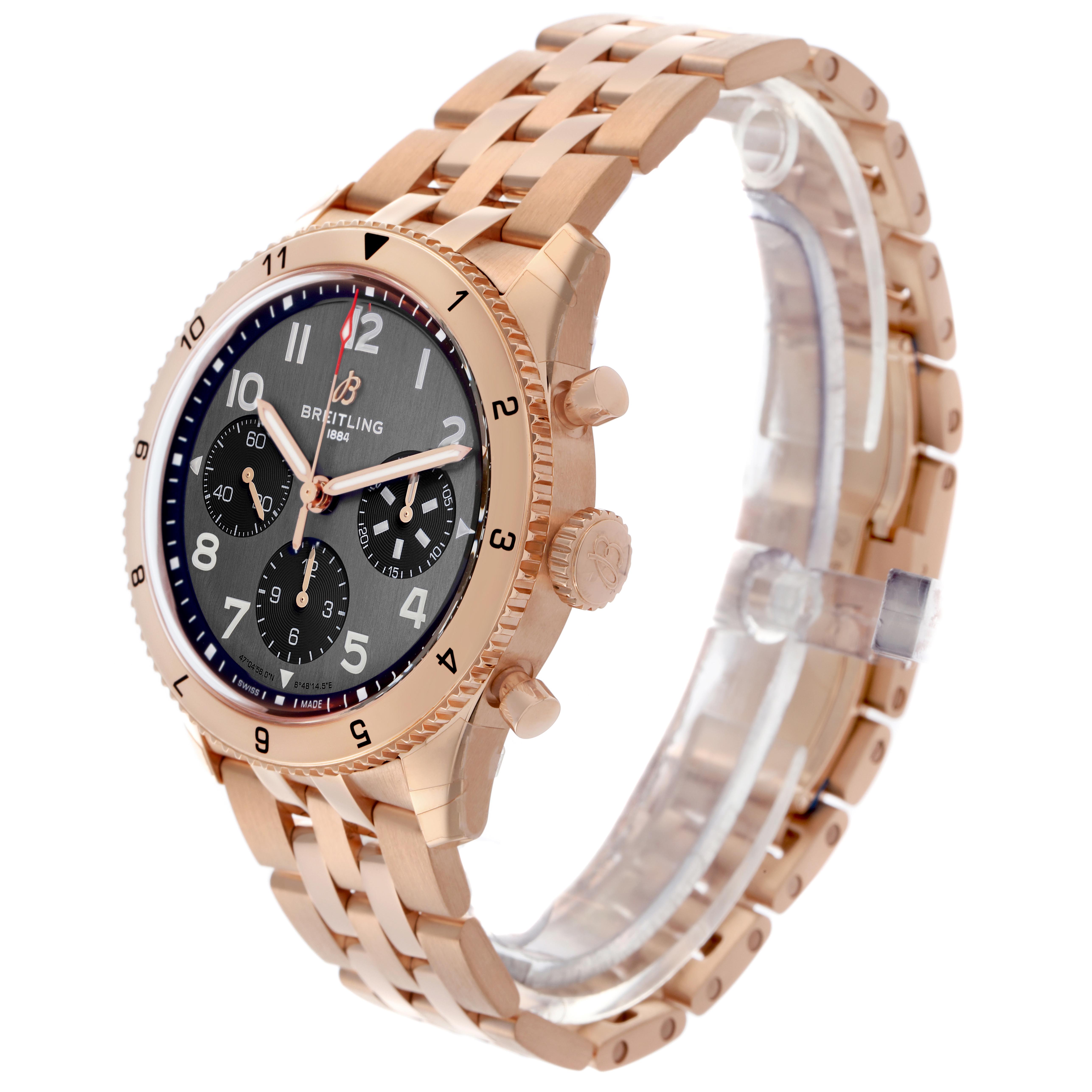 The Breitling Aviator R23380 Men's Rose Gold Grey Dial R23380 Men's Rose Gold Grey Dial watch is shown at an angled side view, highlighting the rose gold bracelet, case, crown, and dial features.