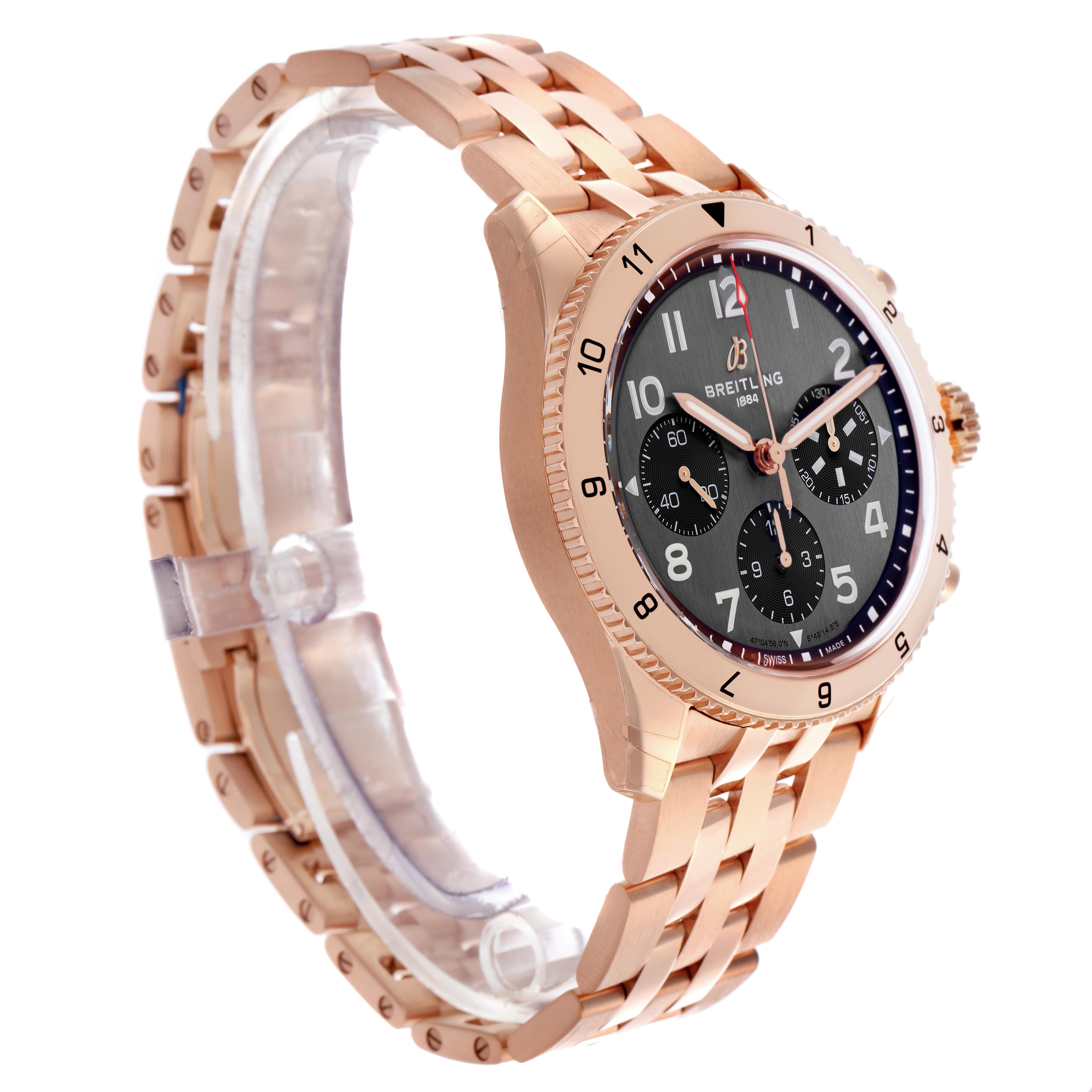 The Breitling Aviator R23380 Men's Rose Gold Grey Dial R23380 Men's Rose Gold Grey Dial watch is shown at a three-quarter angle, revealing the face, bezel, crown, and bracelet from the side.