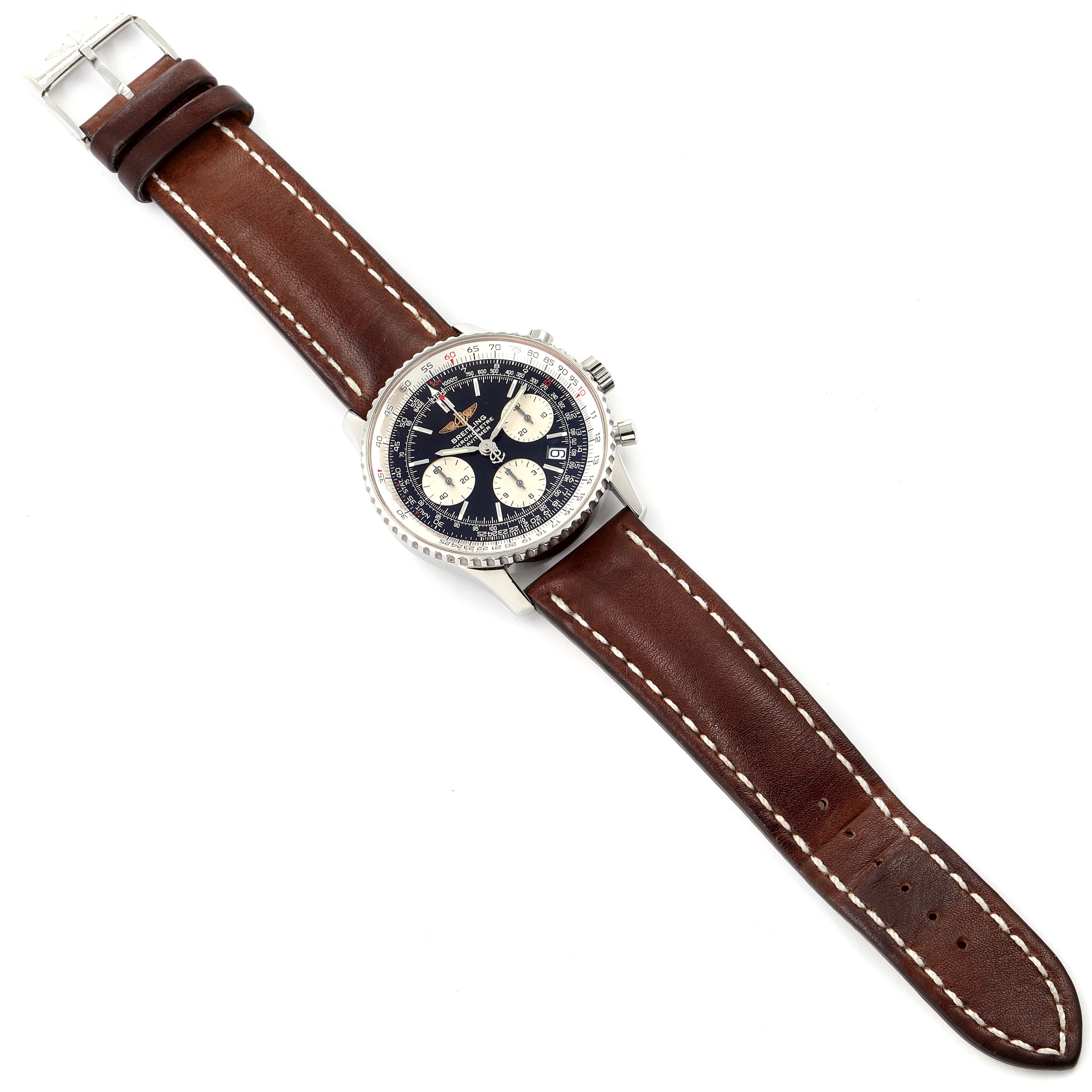The image shows a top view of the Navitimer model by Breitling, featuring the watch face, case, and brown leather strap.