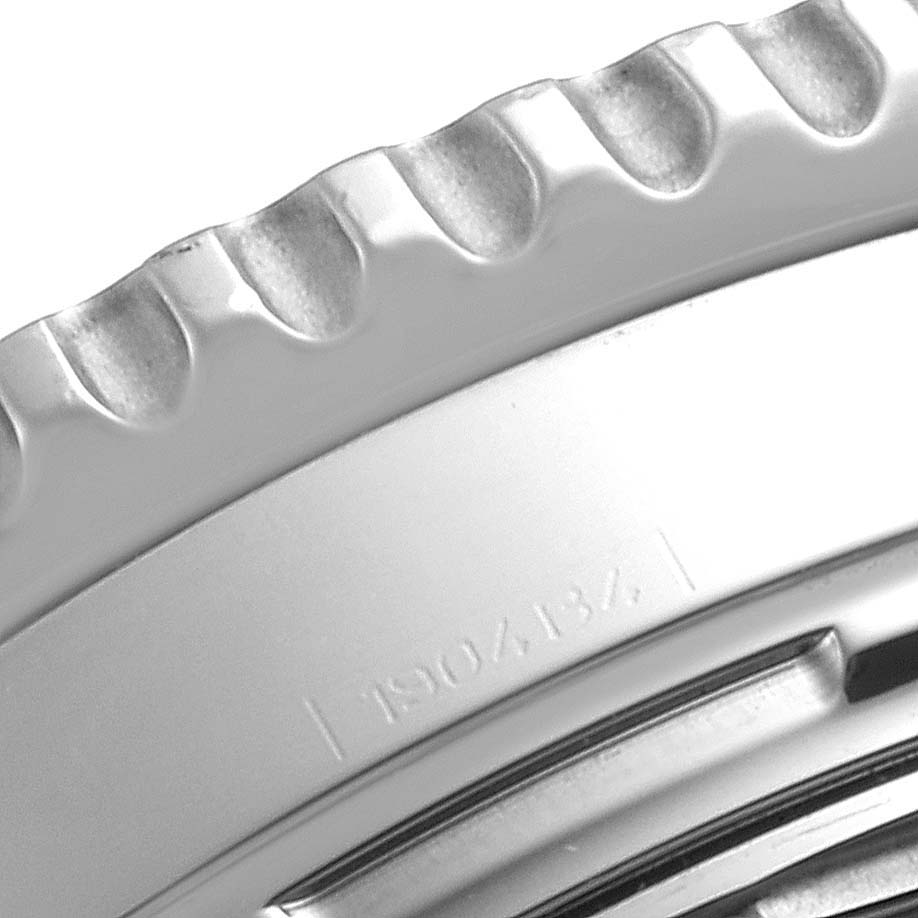 Close-up of the bezel and part of the case back of a Breitling Navitimer A23322 Men
s Stainless Steel Black Dial A23322 Men
s Stainless Steel Black Dial watch.