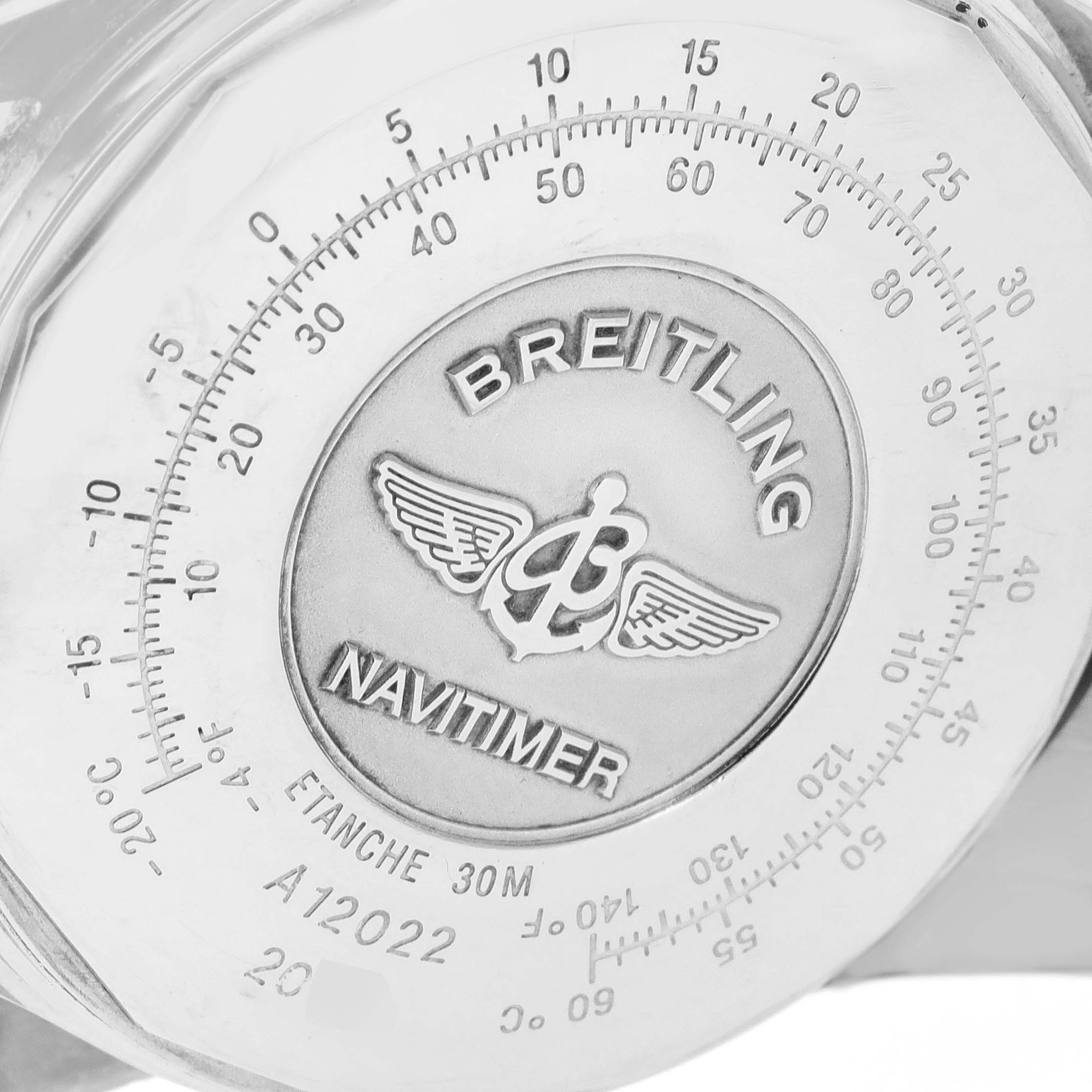 The image shows the back casing of the Breitling Navitimer A12022 Men
s Stainless Steel Blue Dial A12022 Men
s Stainless Steel Blue Dial watch, highlighting the engraved emblem and measurement scales.