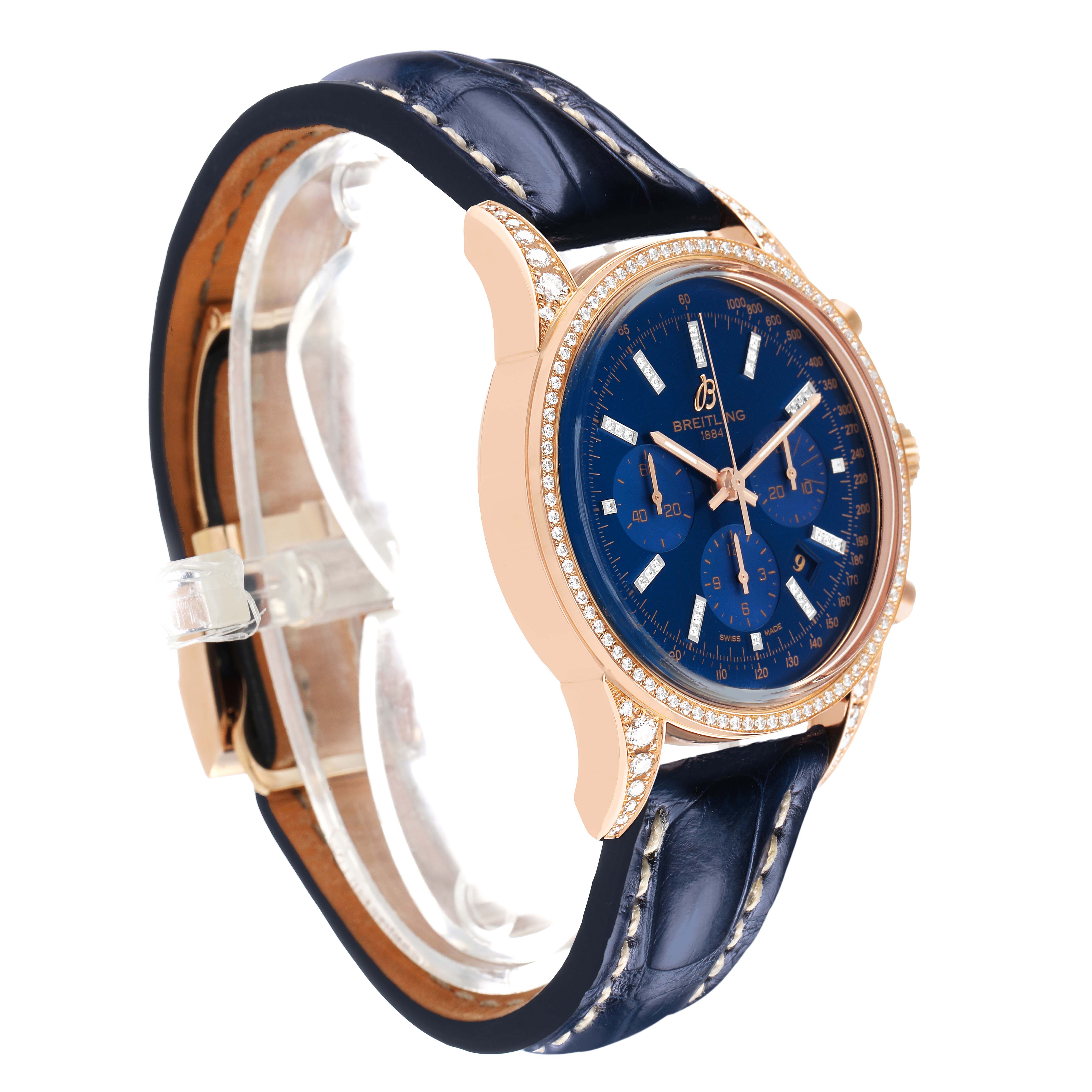 The Breitling Transocean RB0152 Men's Rose Gold Blue Dial watch is shown from a side angle, highlighting the dial, case, and strap.