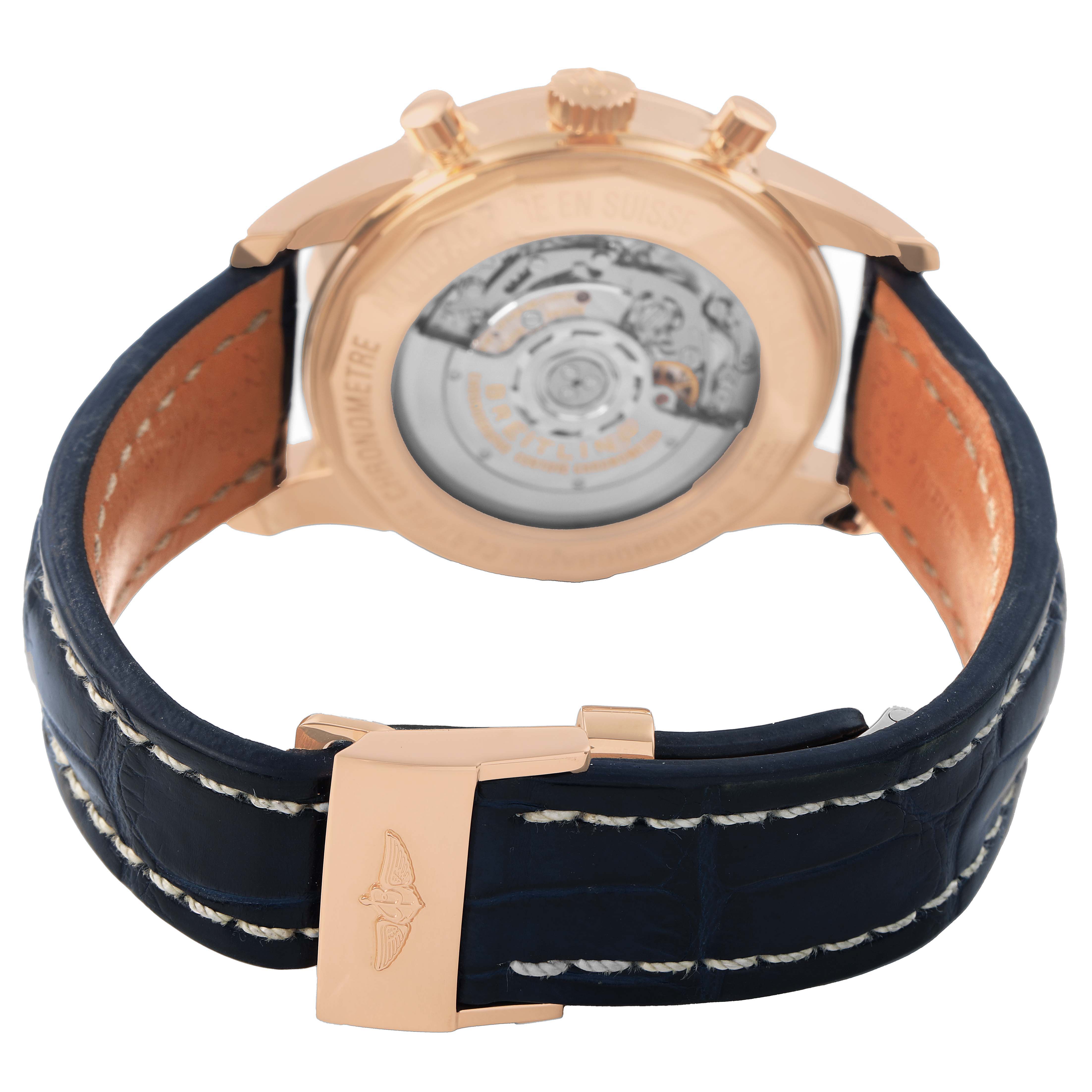The image shows the Breitling Transocean RB0152 Men's Rose Gold Blue Dial watch from the rear, highlighting its movement and leather strap.