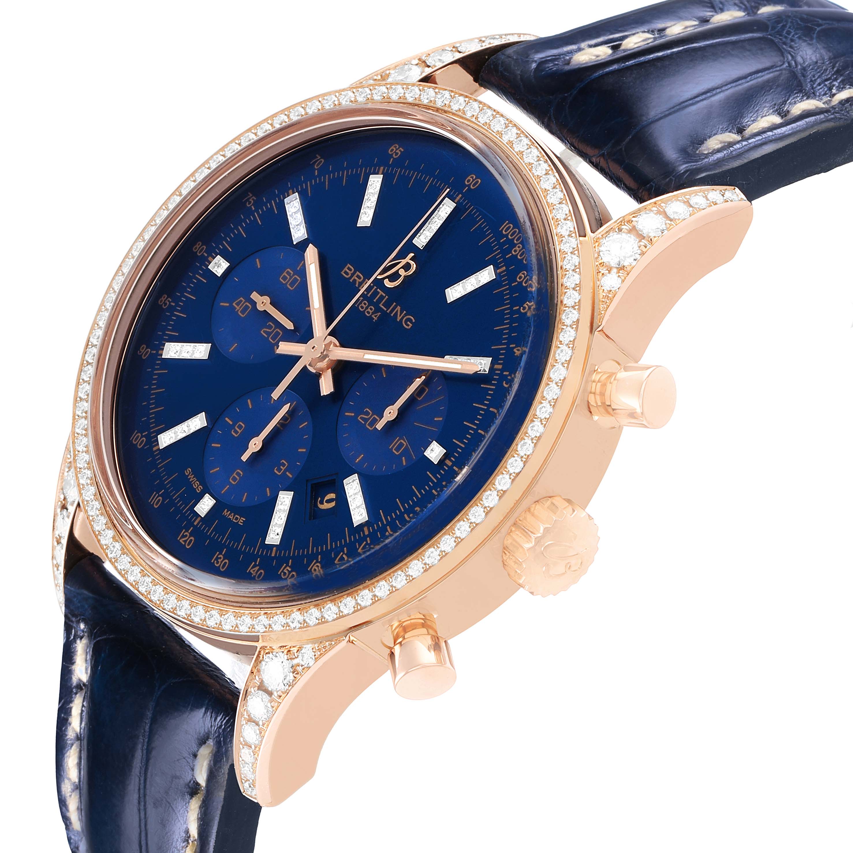 The Breitling Transocean RB0152 Men's Rose Gold Blue Dial watch is shown at a side angle, displaying the blue dial, diamond-encrusted bezel, and leather strap.
