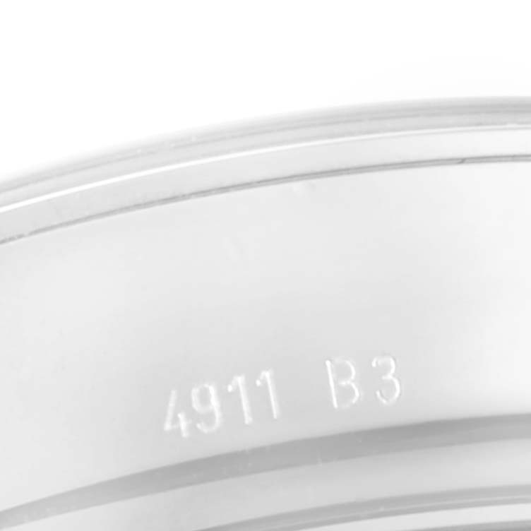 The image shows a close-up of the bezel on a Breitling Transocean AB015212/G724 Men
s Stainless Steel Silver Dial AB015212/G724 Men
s Stainless Steel Silver Dial watch, with the marking "4911 B3."