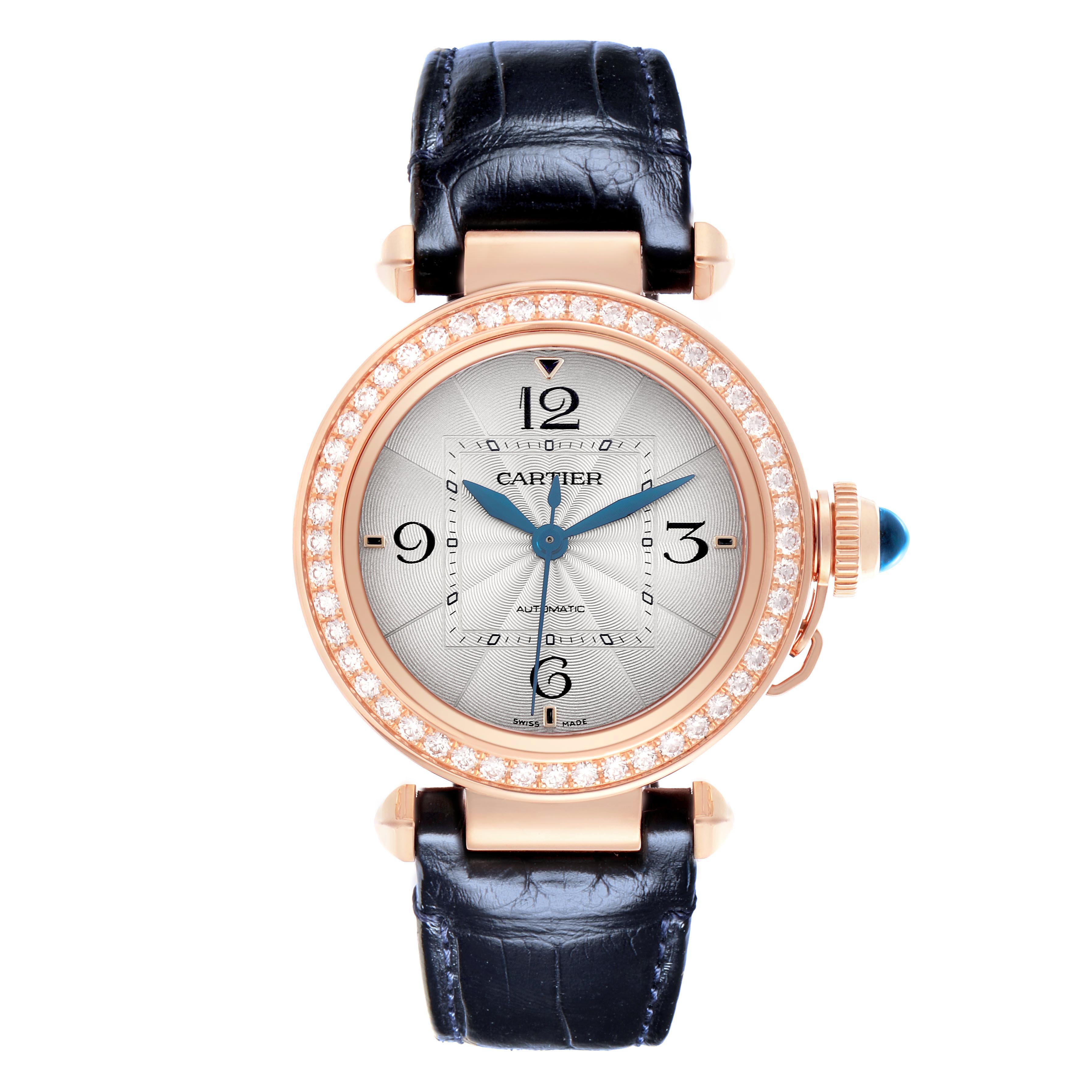 The Cartier Pasha WJPA0012 Women's Rose Gold Silver Dial watch is shown from a front angle highlighting its dial, bezel with diamonds, leather strap, and crown.